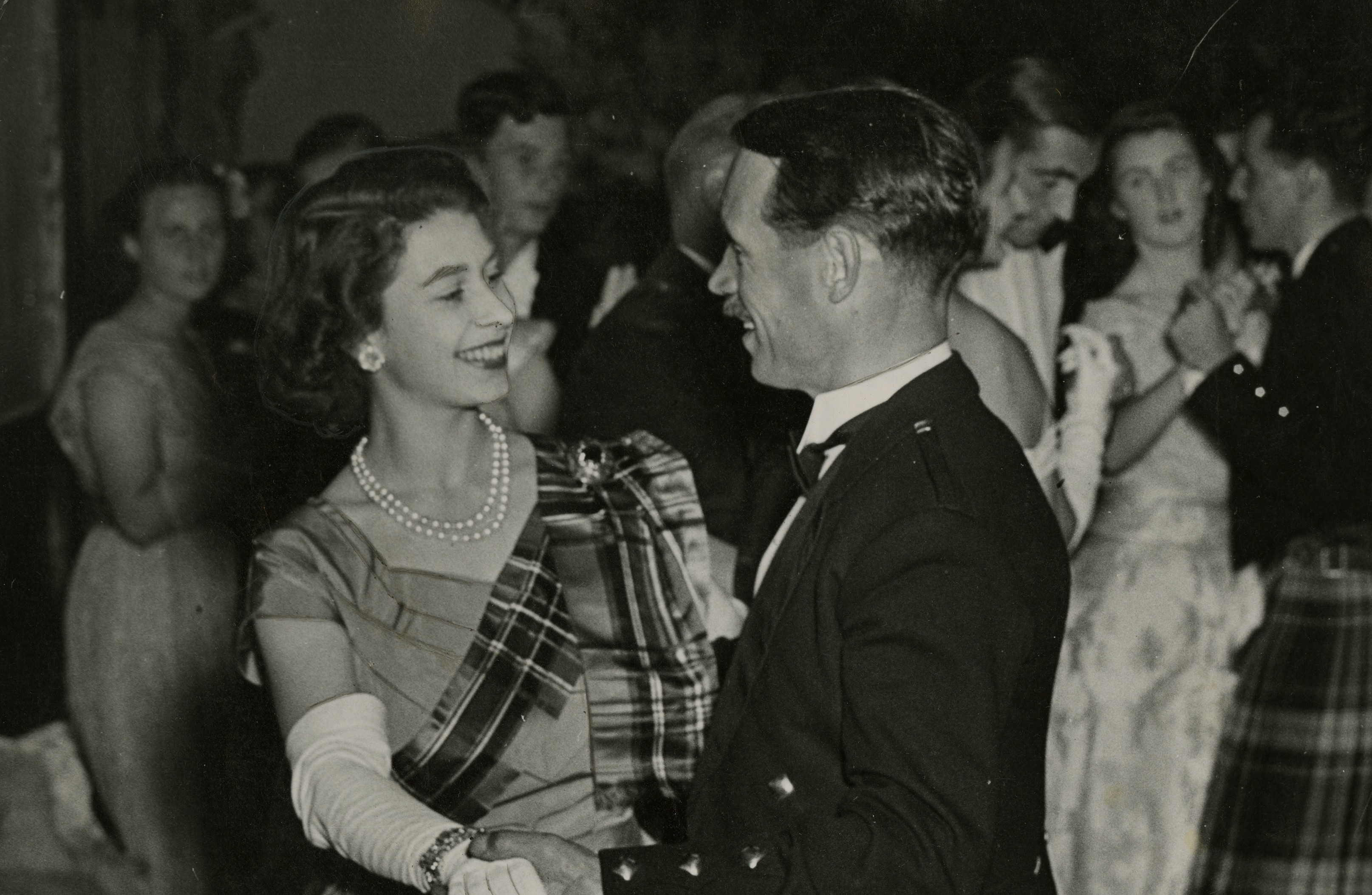 Just like any young woman of her time the Princess enjoyed hitting the dancefloor. Here she is dancing with a Mr David Bogle at the 1949 Aboyne Ball (AJL)