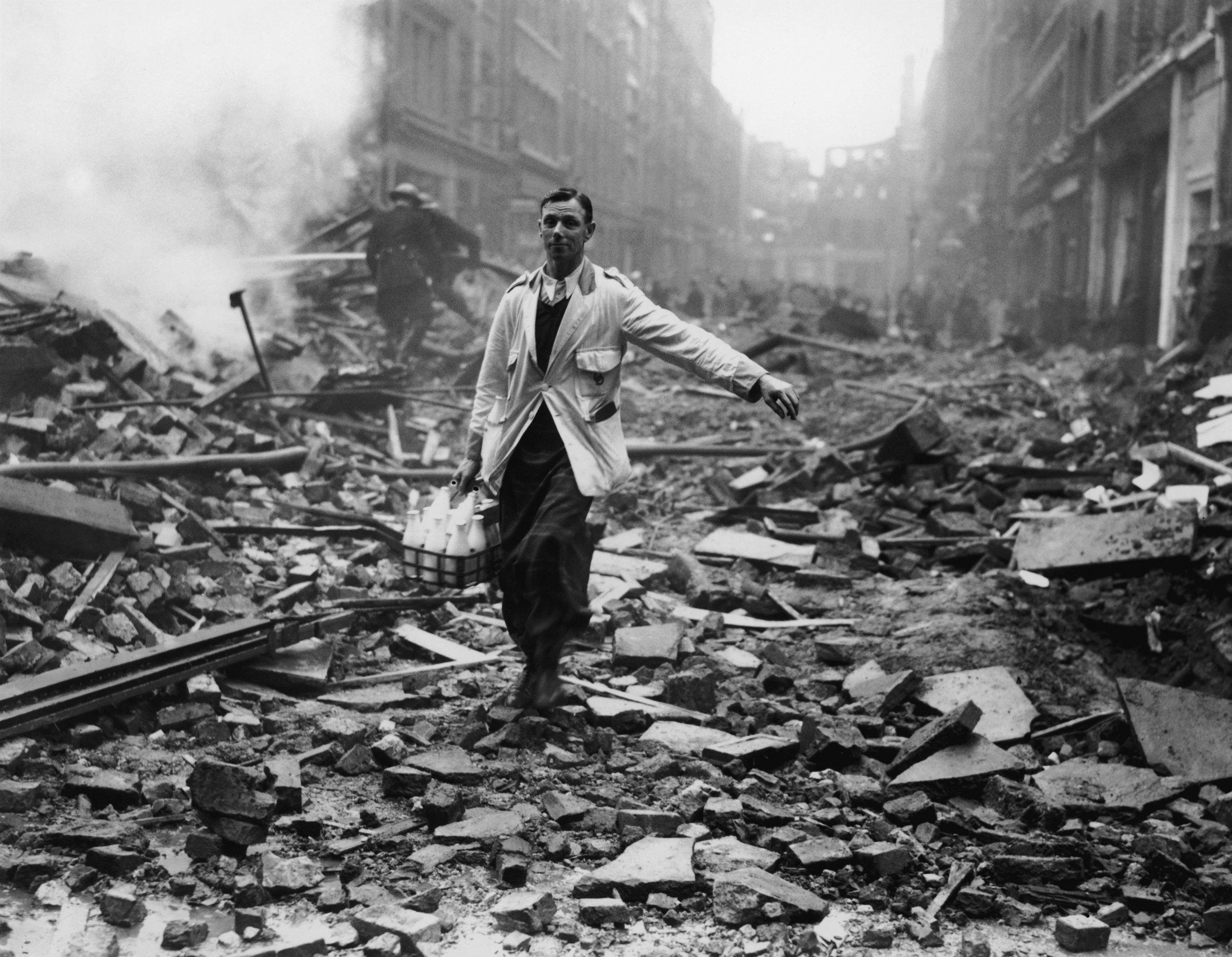 A milkman makes deliveries after a German bomb raid (Fred Morley/Getty Images)