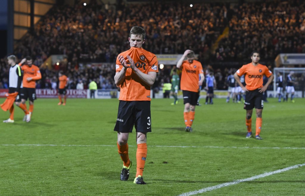 Dejected Dundee United players at full time (SNS Group)