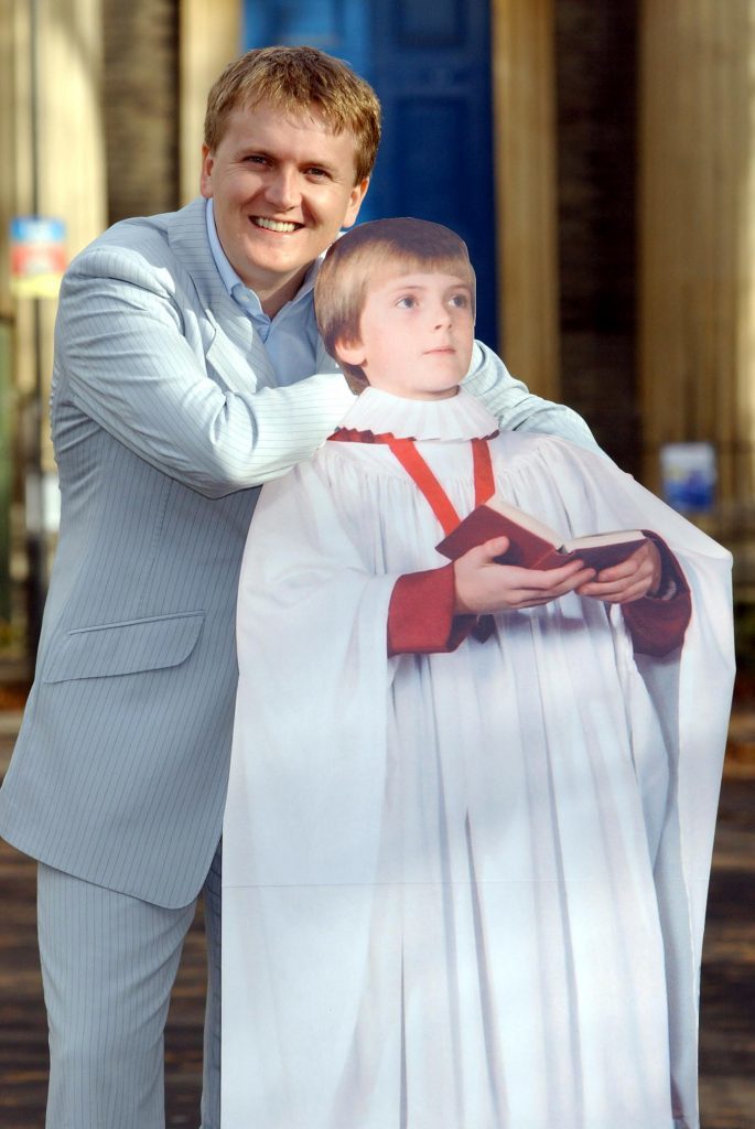 Singer Aled Jones poses with cardboard cut-out of himself as a young choirboy (PA Archive)