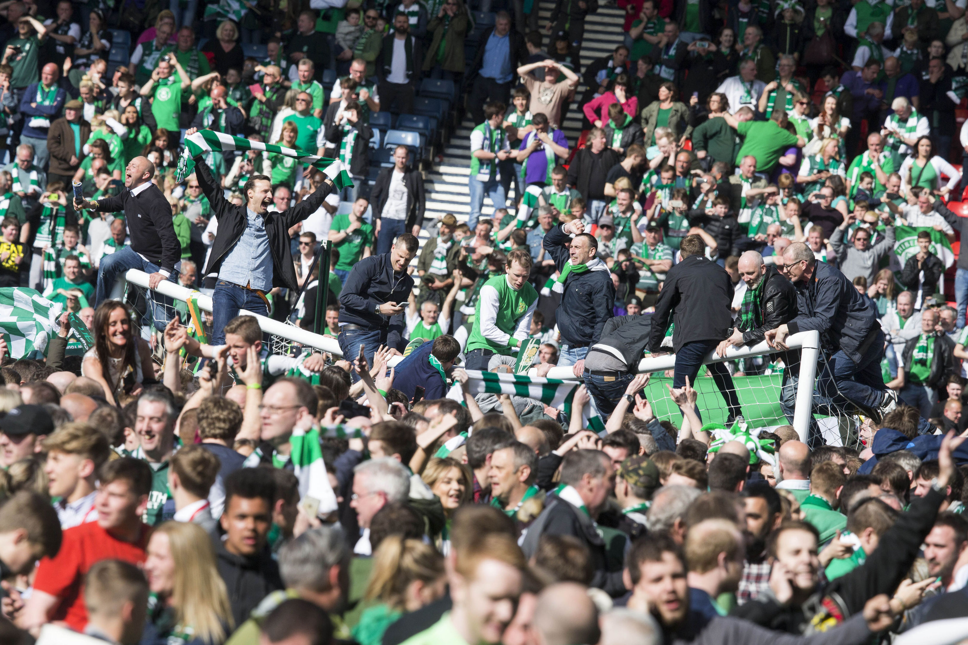 Fans invade the pitch (Jeff Holmes/PA Wire)