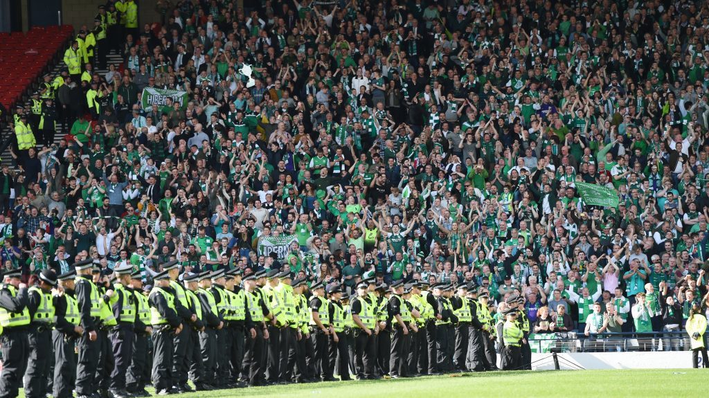 Police block off the pitch as Hibernian fans celebrate their clubs historic win (SNS Group)