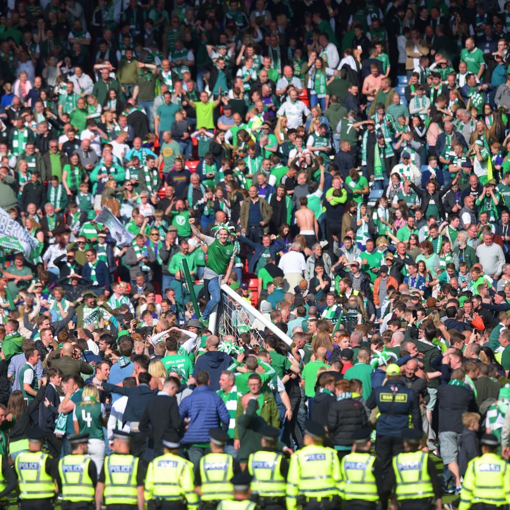 Hibs fans rush the pitch to celebrate their side's historic win (SNS Group)