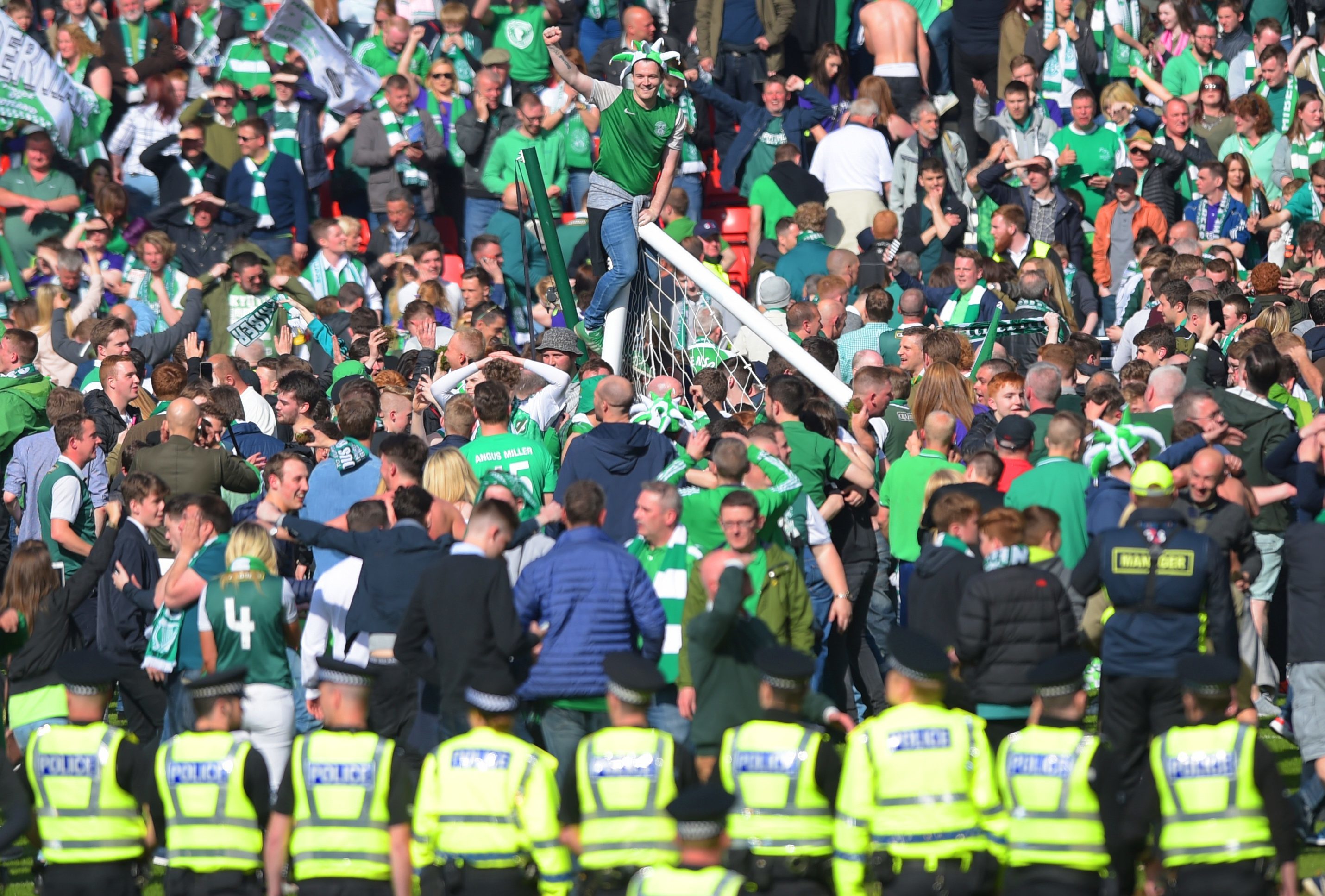 Hibs fans rush the pitch to celebrate their side's historic win (SNS Group)