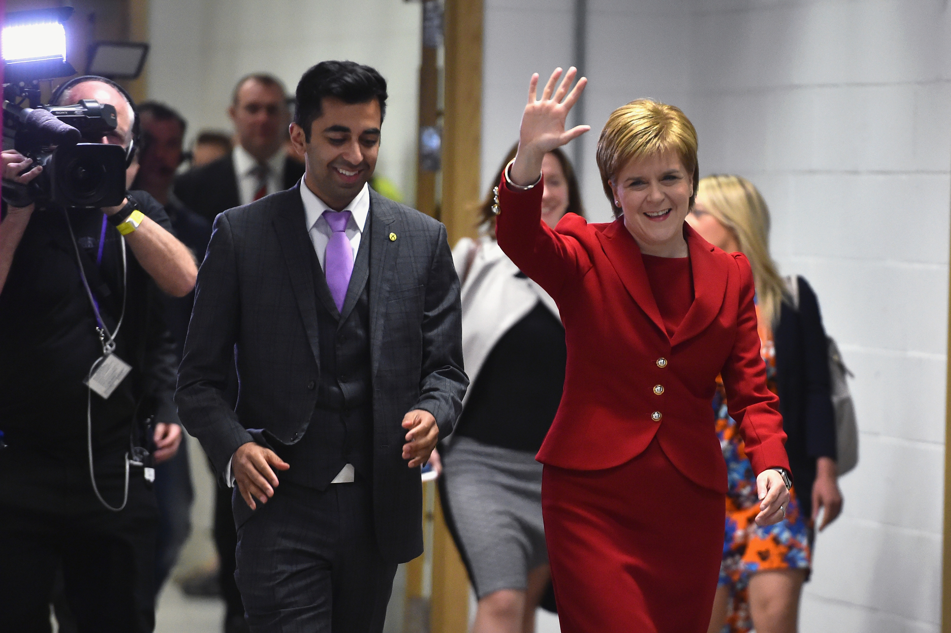 SNP leader Nicola Sturgeon arrives with Humza Yousaf at the count for the Scottish Parliament elections at the Emirates Arena (Jeff J Mitchell/Getty Images)