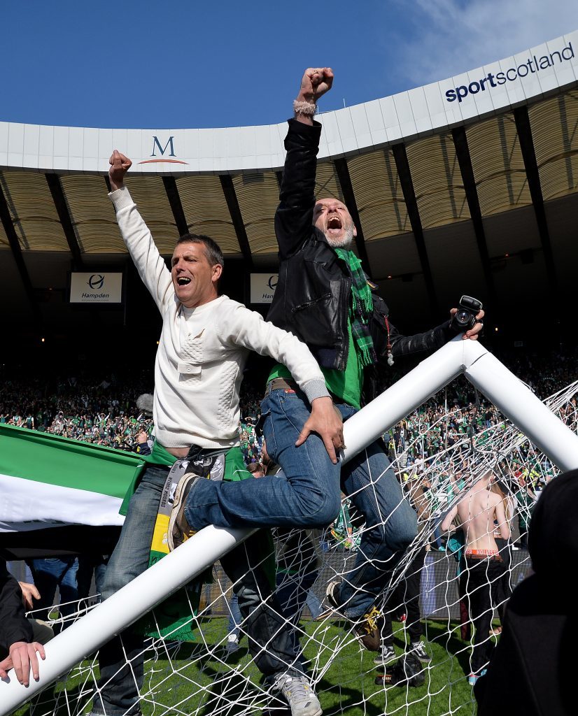 Fans invade the Hampden pitch (Mark Runnacles/Getty Images)