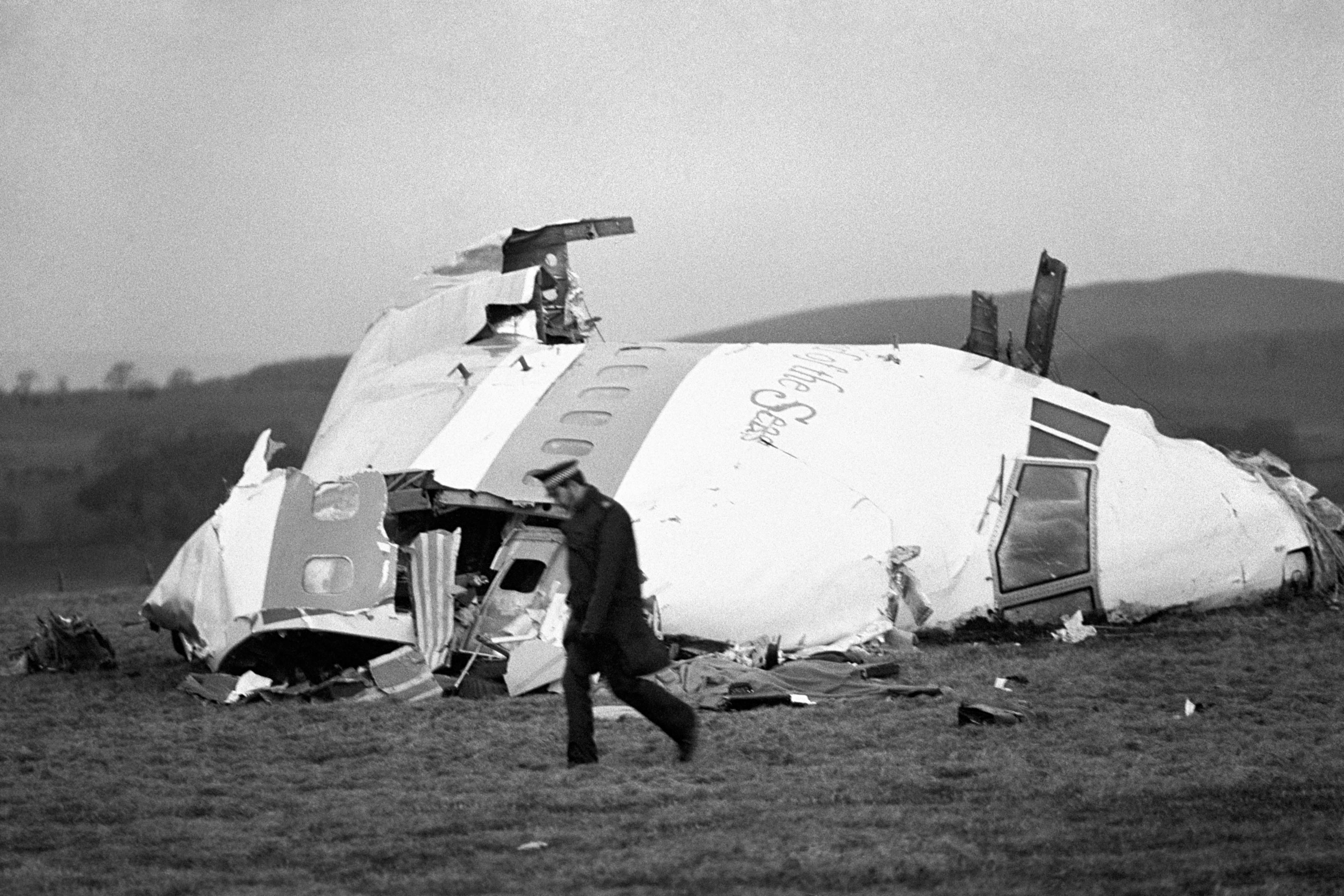 The wrecked nose section of the Pan-Am Boeing 747 lies in a Scottish field at Lockerbie, near Dumfries, after the plane, which had been flying from Frankfurt to New York, was blown apart by a terrorist bomb (PA)