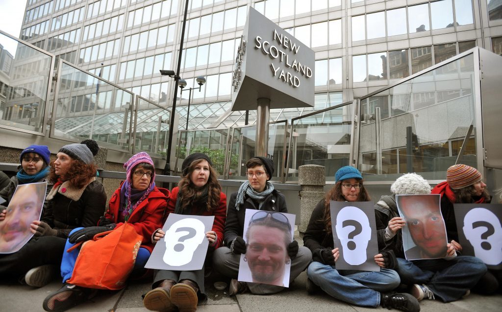 Protesters blockade New Scotland Yard, London, as they called for a judge-led inquiry into the use of undercover policing