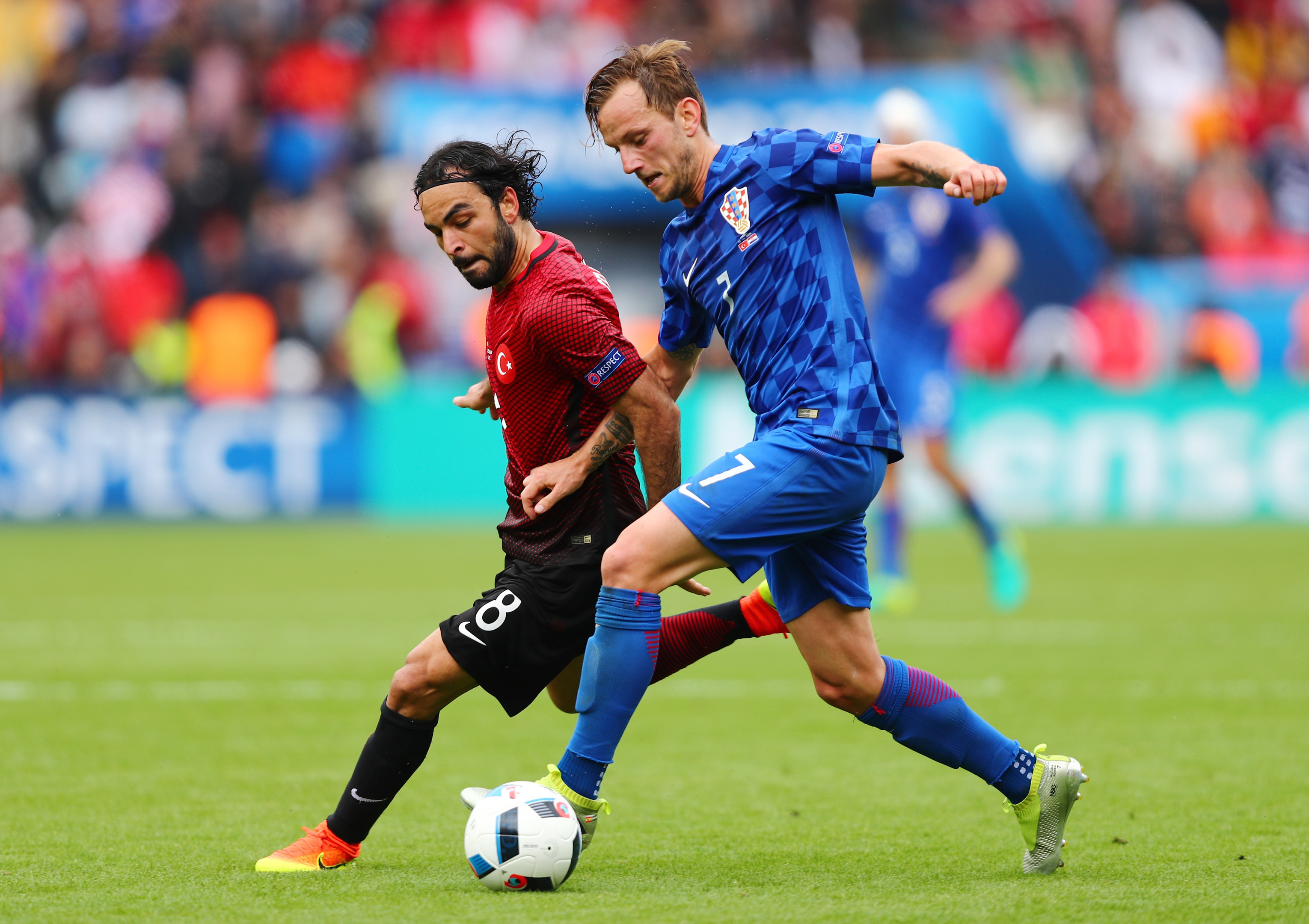 Ivan Rakitic of Croatia (in blue) and Selcuk Inan of Turkey compete for the ball during the UEFA EURO 2016 Group D match (Clive Rose/Getty Images)