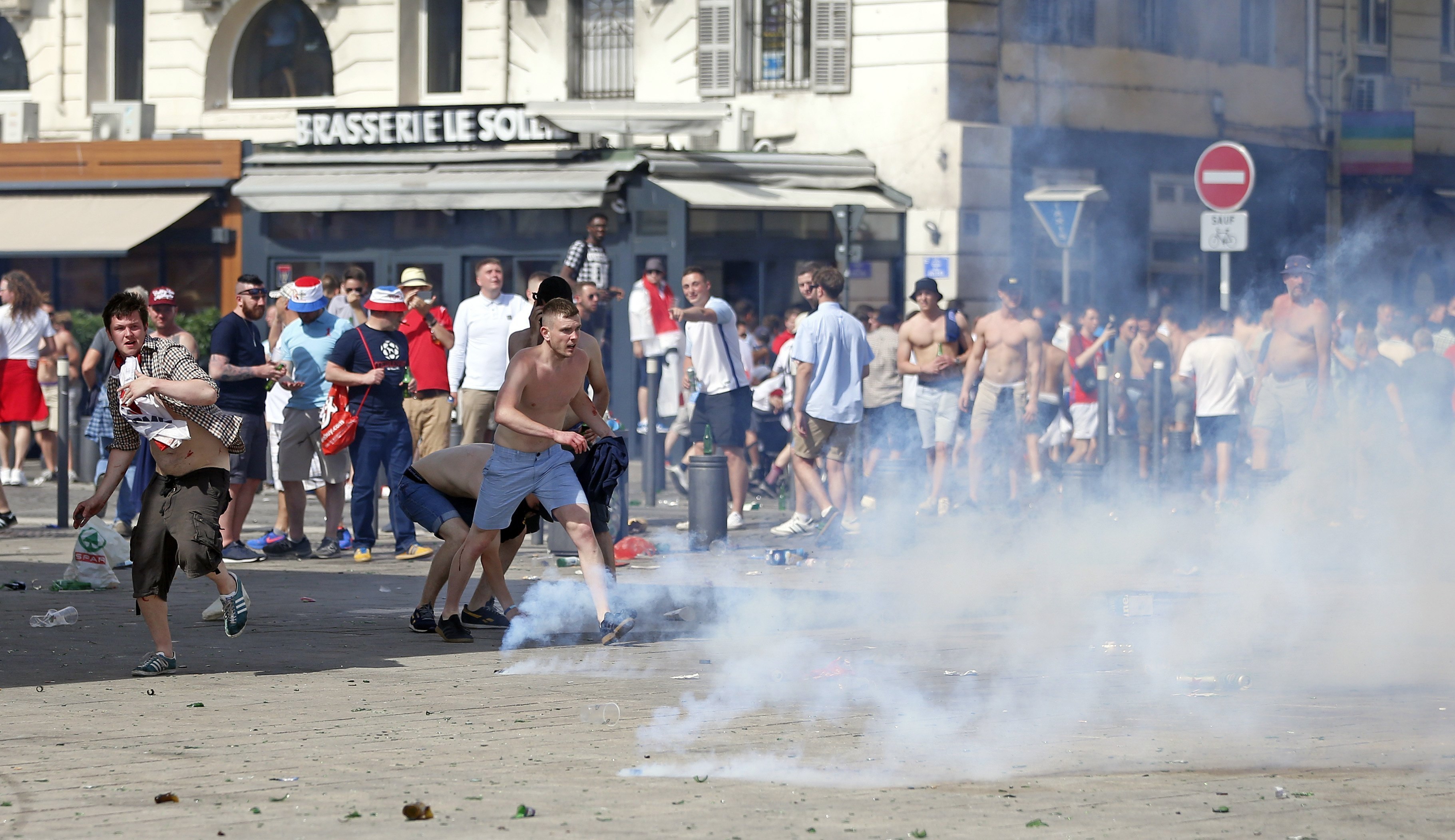 Teargas is fired at England supporters in downtown Marseille, France (AP Photo/Darko Bandic)