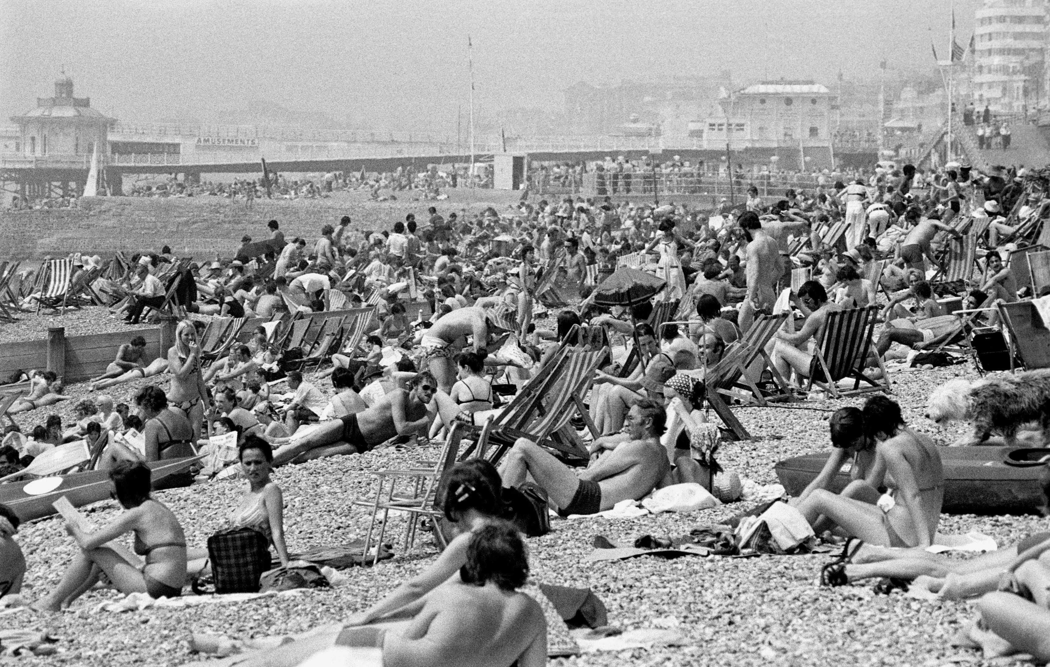 The scene on Brighton beach as temperatures soared to 80C, during June, 1976 (PA)