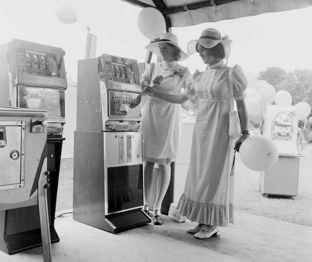 Fruit machines in an amusement marquee at Henley Royal Regatta, 1971 (William Vanderson/Fox Photos/Hulton Archive/Getty Images)