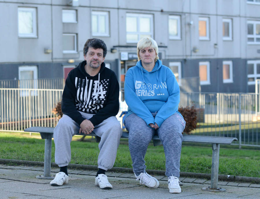 Sharon Brooke, aged 44, outside her home, Wester Common Road, Glasgow, with her partner Barry James Catt (Hemedia)