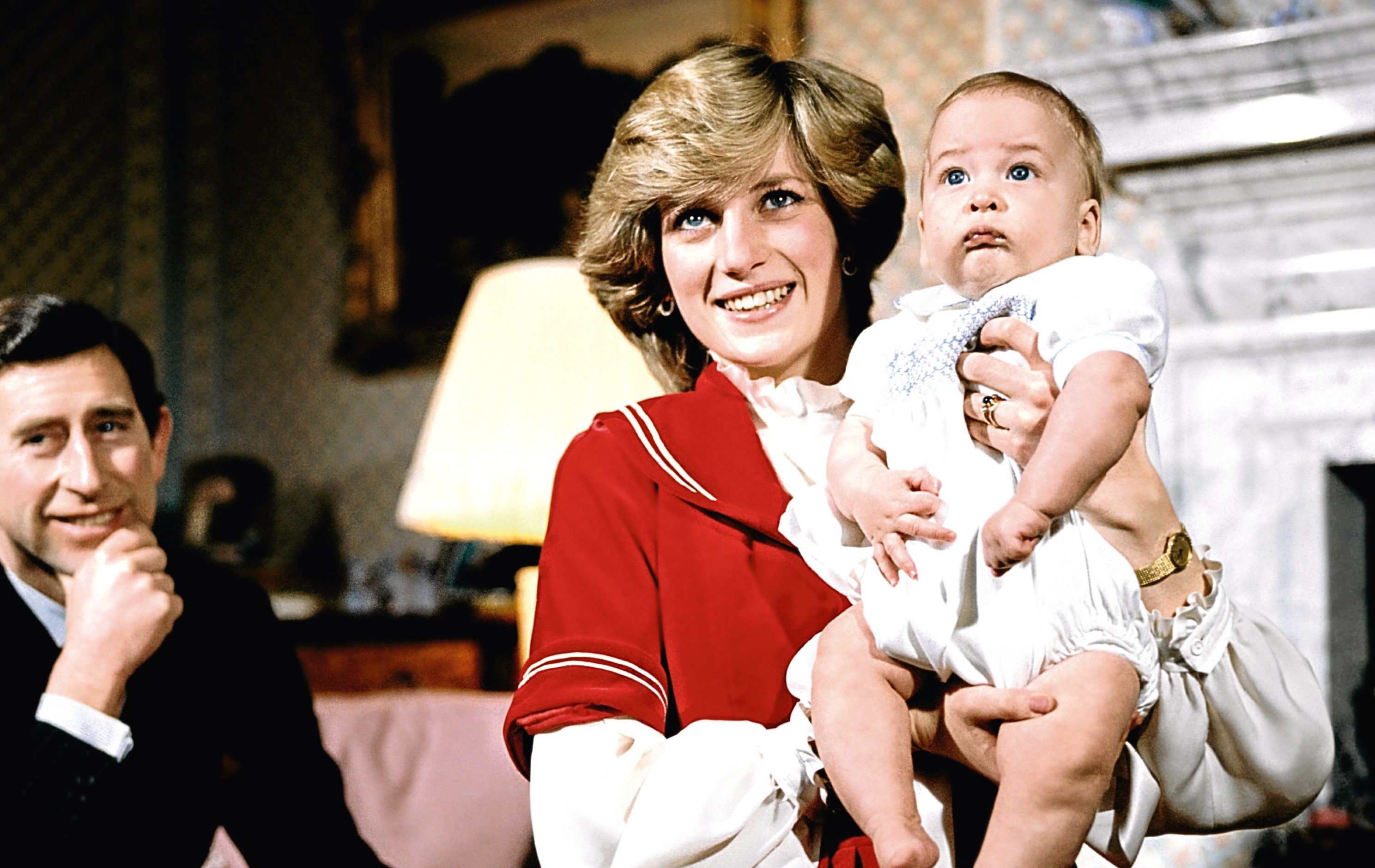 The Prince and Princess of Wales at Kensington Palace with baby son Prince William (PA Archive)