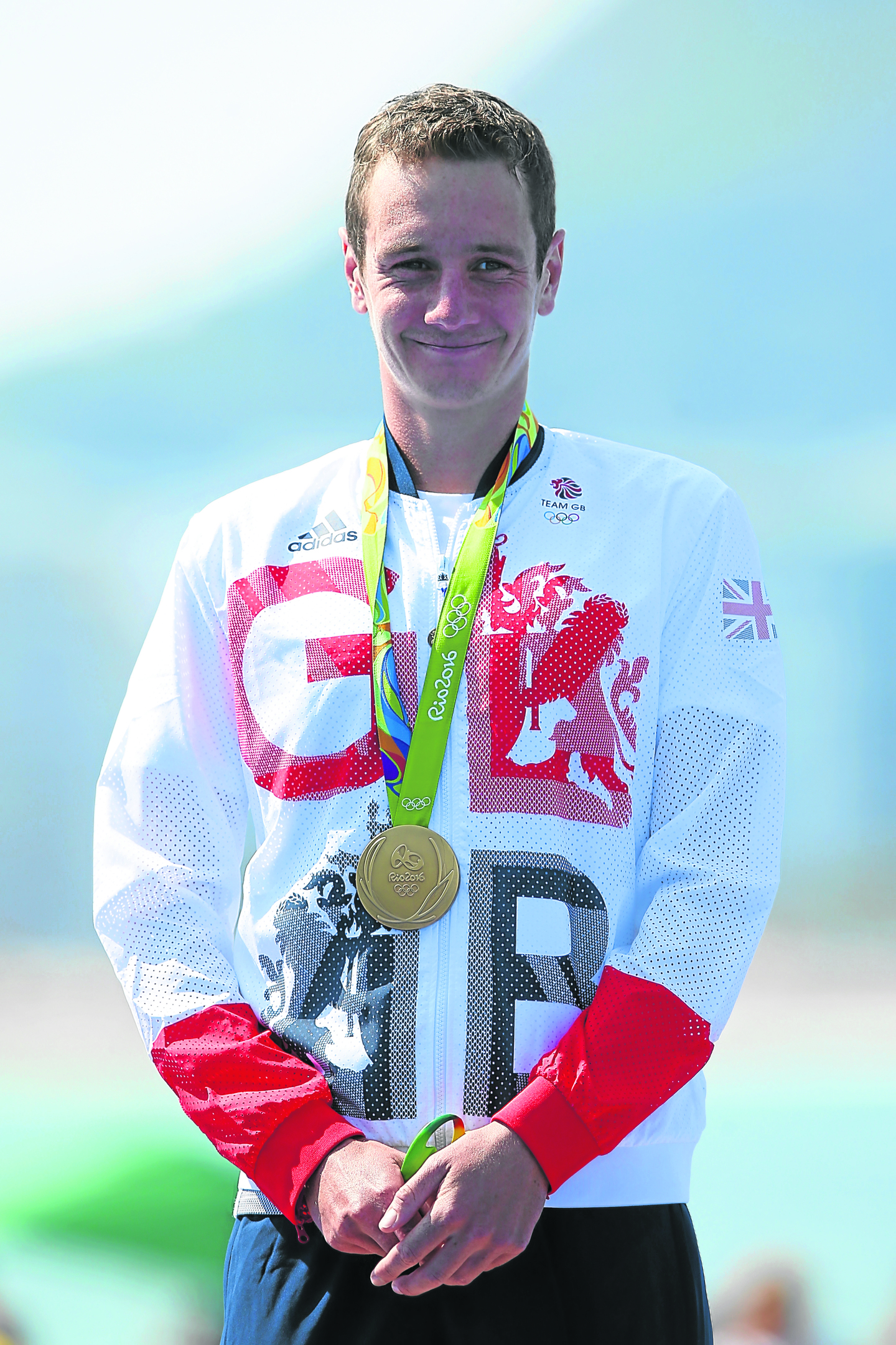 Gold medallist Alistair Brownlee of Great Britain celebrates on the podium during the Men's Triathlon (Photo by Alex Livesey/Getty Images)