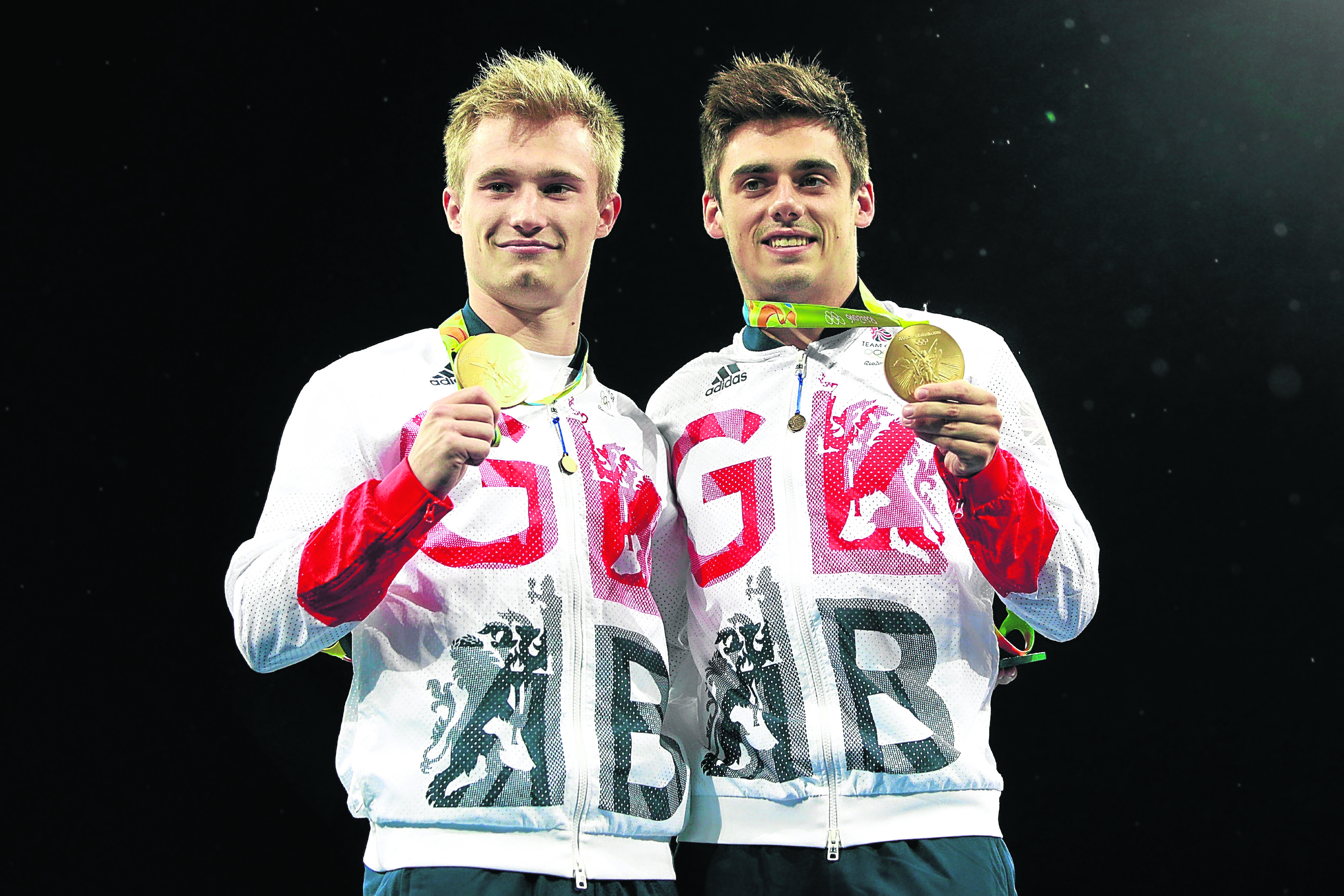 (L-R) Gold medalists Jack Laugher and Chris Mears of Great Britain pose during the medal ceremony for the Men's Diving Synchronised 3m Springboard Final (Photo by Adam Pretty/Getty Images)