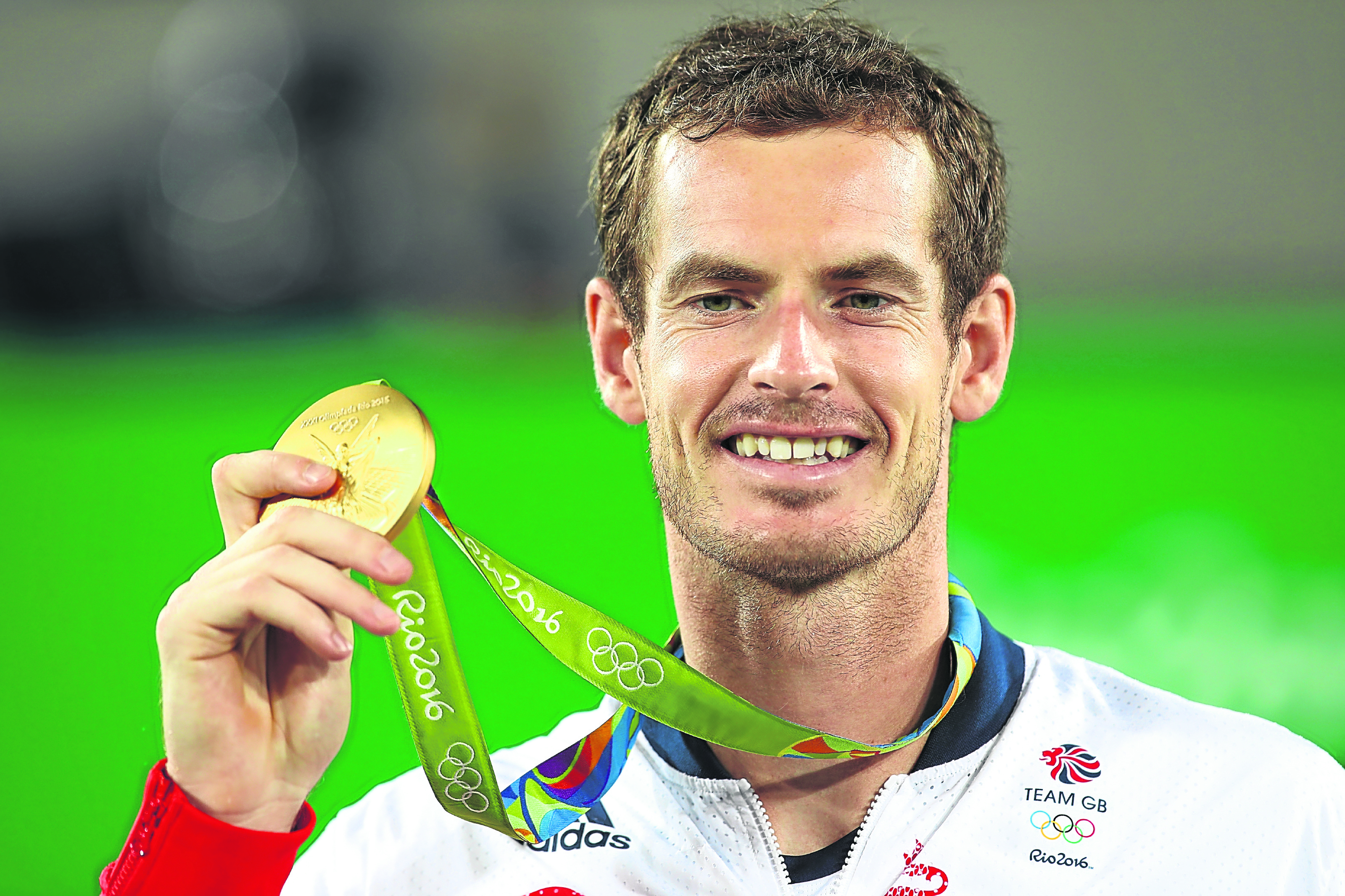 Gold medallist Andy Murray of Great Britain poses on the podium during the medal ceremony for the men's singles (Photo by Clive Brunskill/Getty Images)