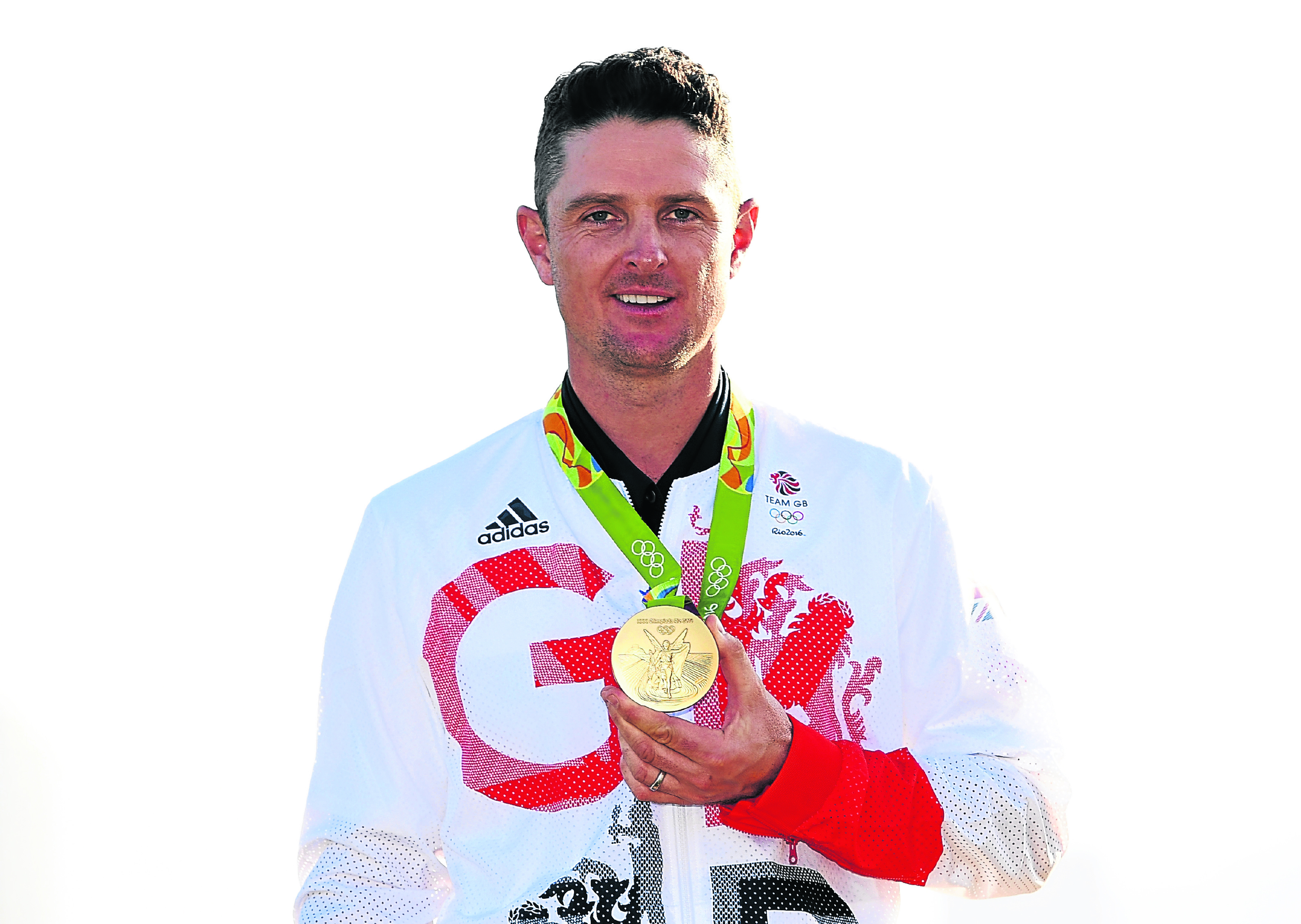 Justin Rose of Great Britain celebrates with the gold medal after winning in the final round of men's golf (Photo by Ross Kinnaird/Getty Images)