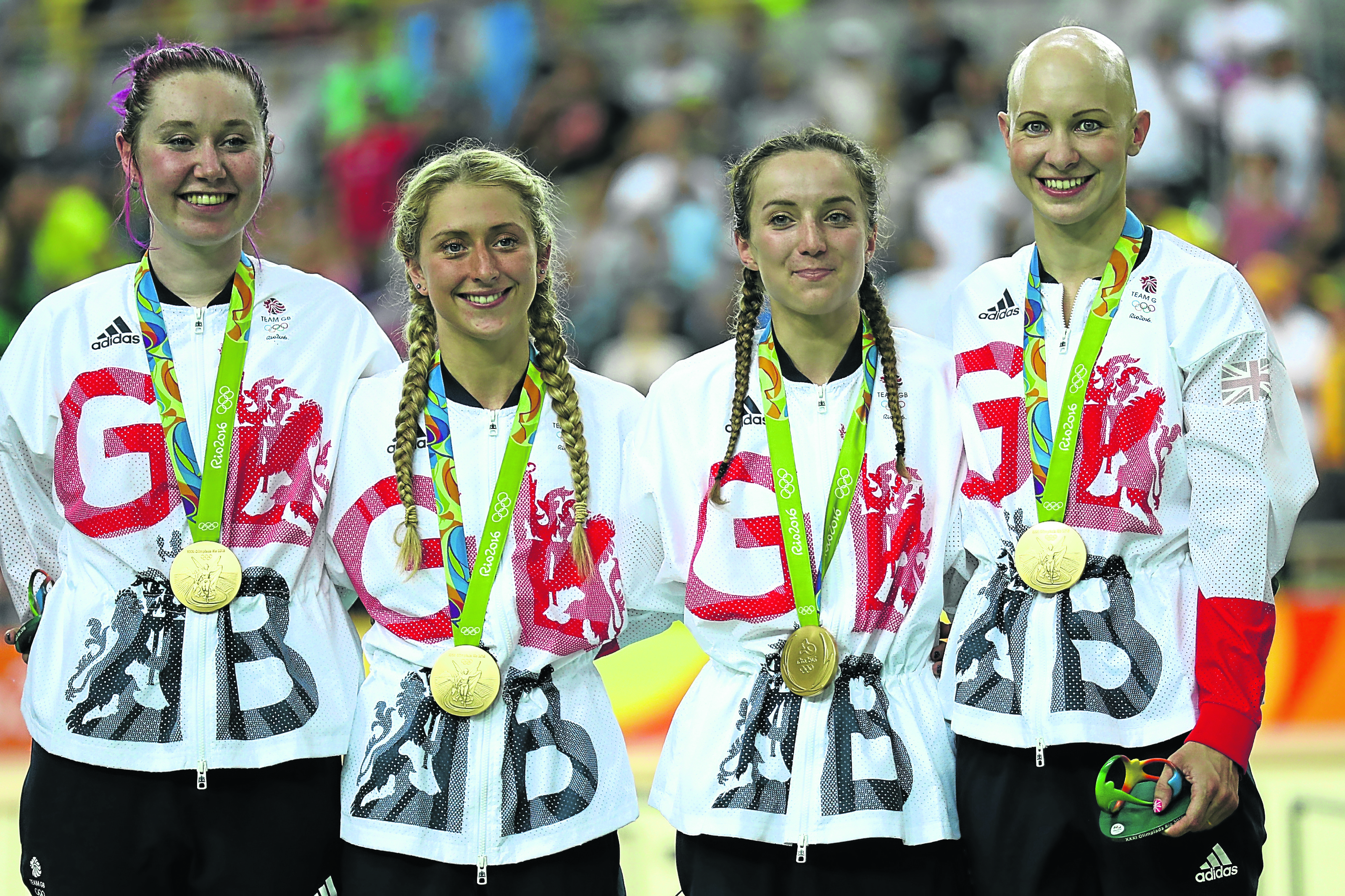 Gold medallists Laura Trott, Joanna Rowsell-Shand, Katie Archibald, Elinor Barker of Great Britain celebrate on the podium at the medal ceremony for the Women's Team Pursuit (Photo by Bryn Lennon/Getty Images)