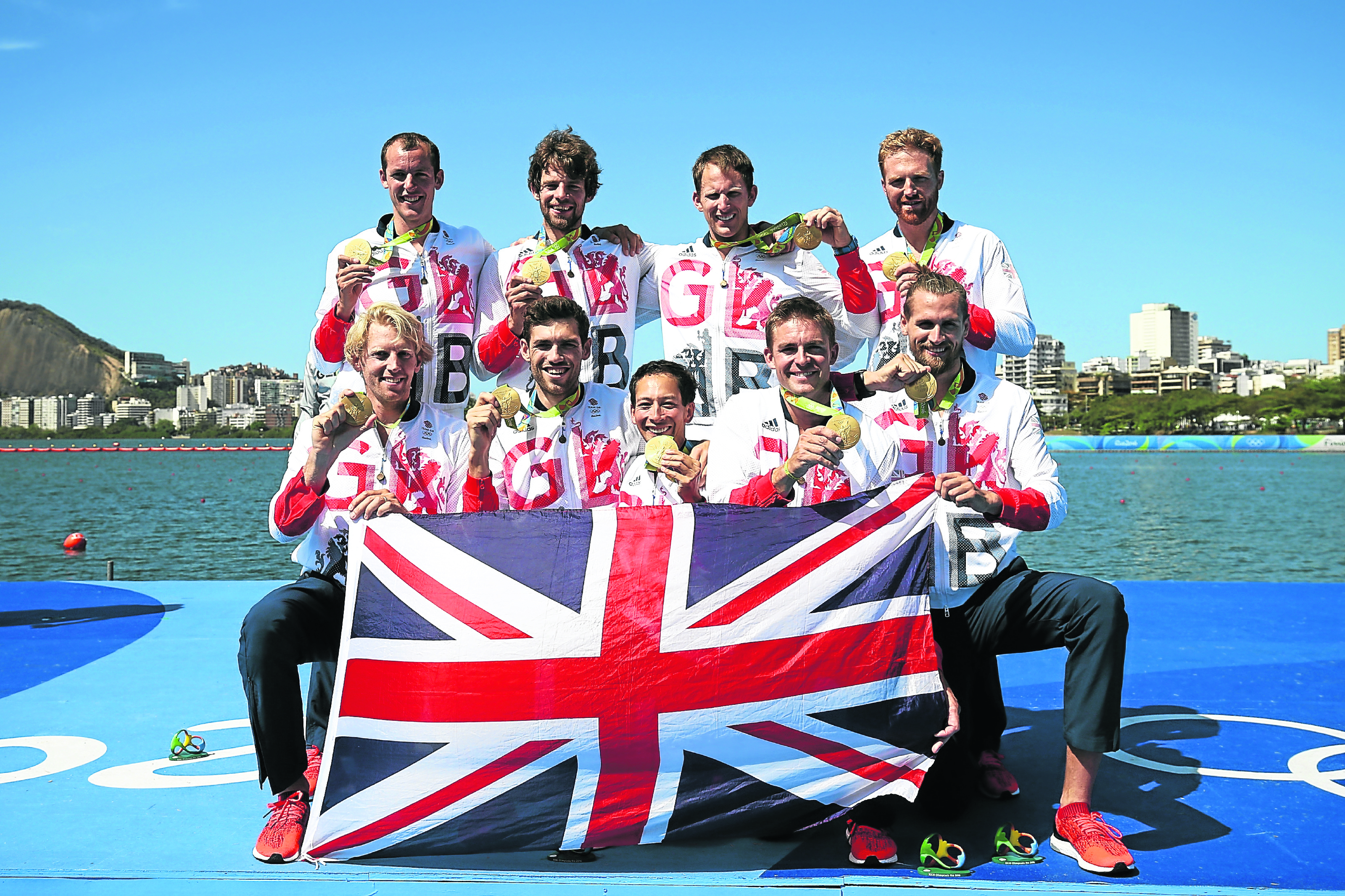  (L to R) Gold medallists Great Britain pose for photographs after the medal ceremony for the Men's Eight (Photo by Buda Mendes/Getty Images)