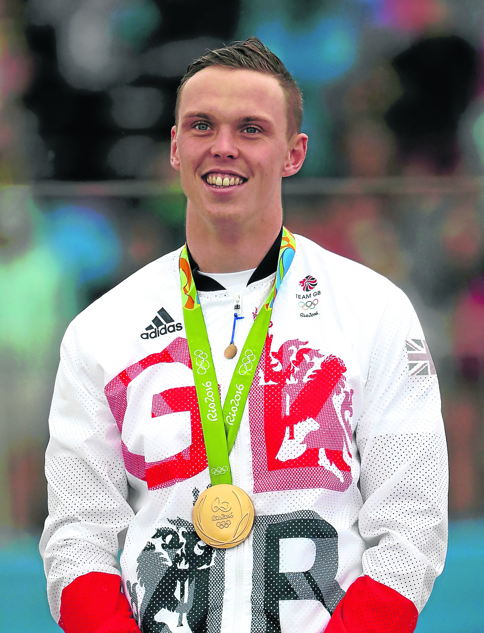 Gold medalist Joseph Clarke of Great Britain stands on the podium after the Kayak (K1) Men's Final (Photo by Christian Petersen/Getty Images)