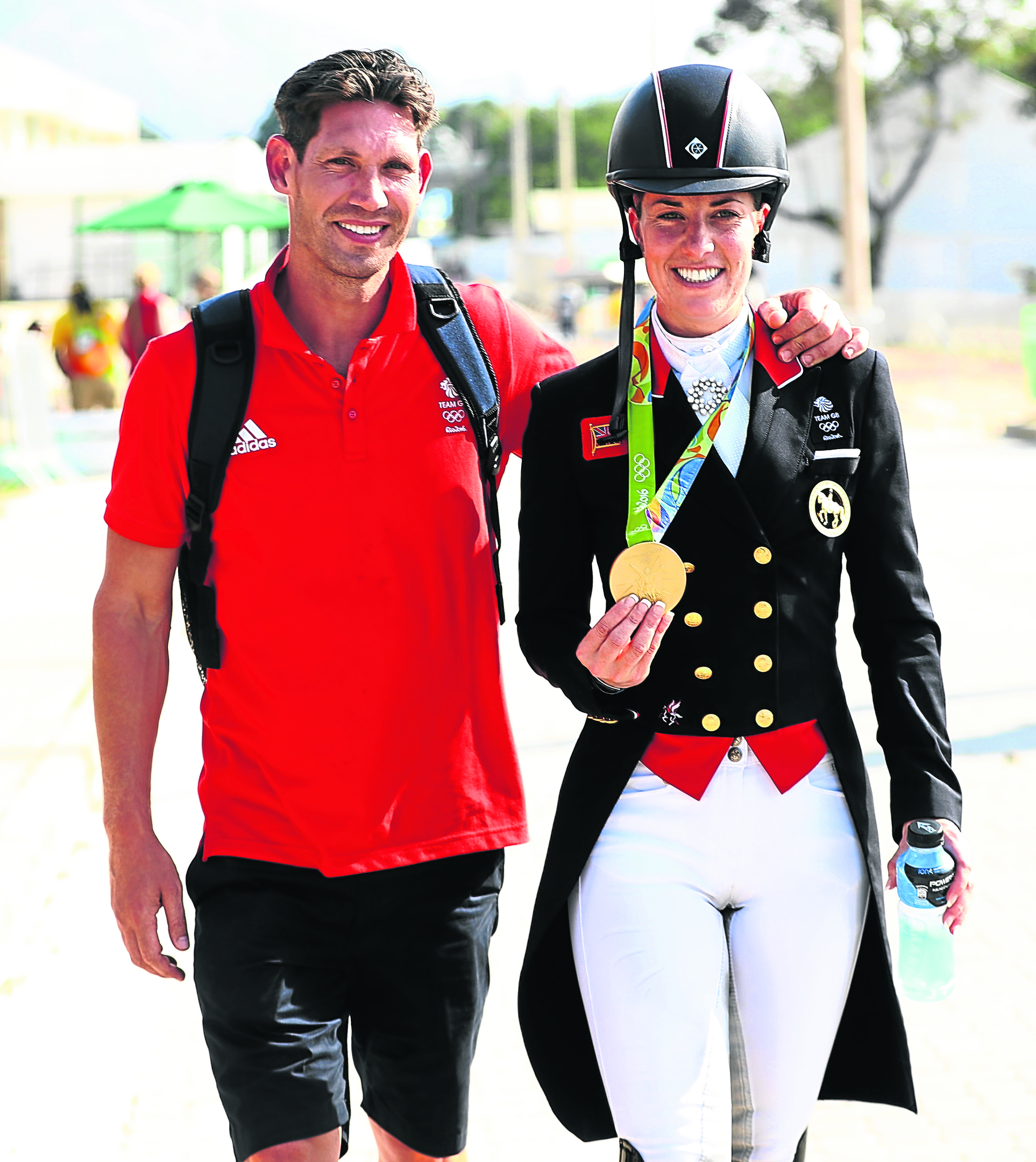Charlotte Dujardin of Great Britain walks with her fiance, Dean Wyatt Golding after winning the gold medal during the Dressage Individual Grand Prix Freestyle (Photo by David Rogers/Getty Images)