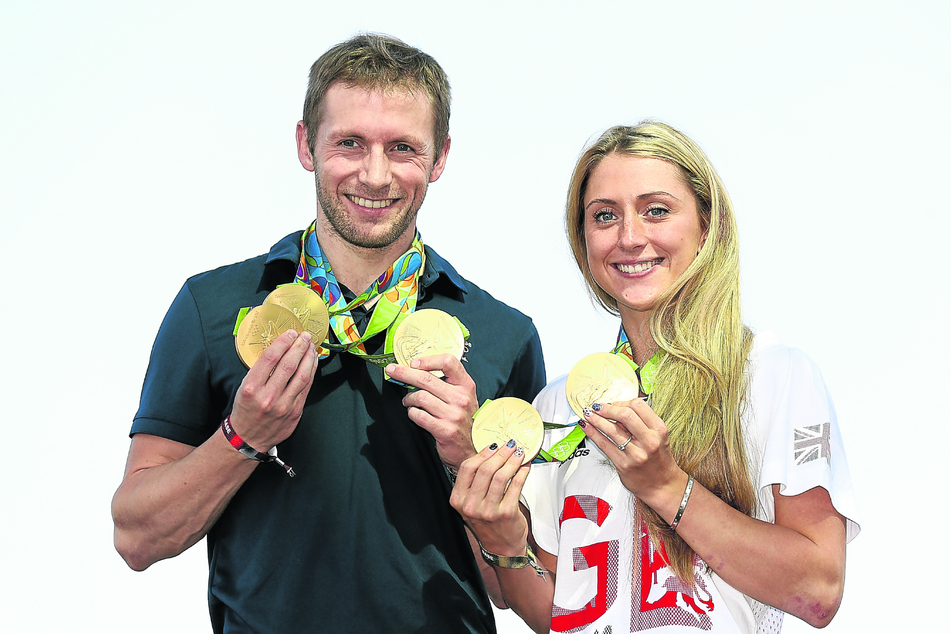 Team GB cyclists Laura Trott and Jason Kenny pose with their gold medals (Photo by Bryn Lennon/Getty Images)