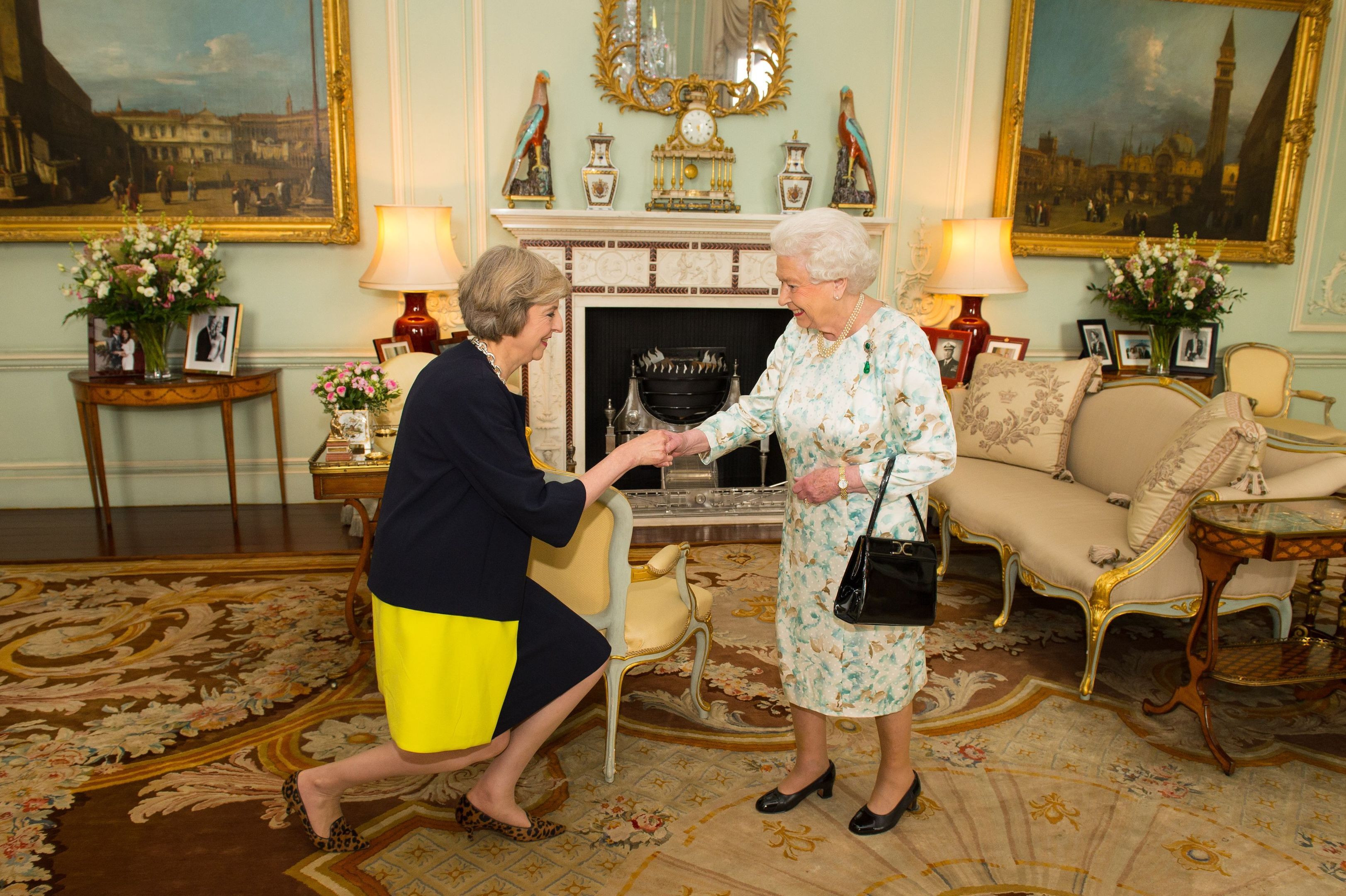 Queen Elizabeth II welcomes Theresa May at the start of an audience in Buckingham Palace (Dominic Lipinski / PA Archive)