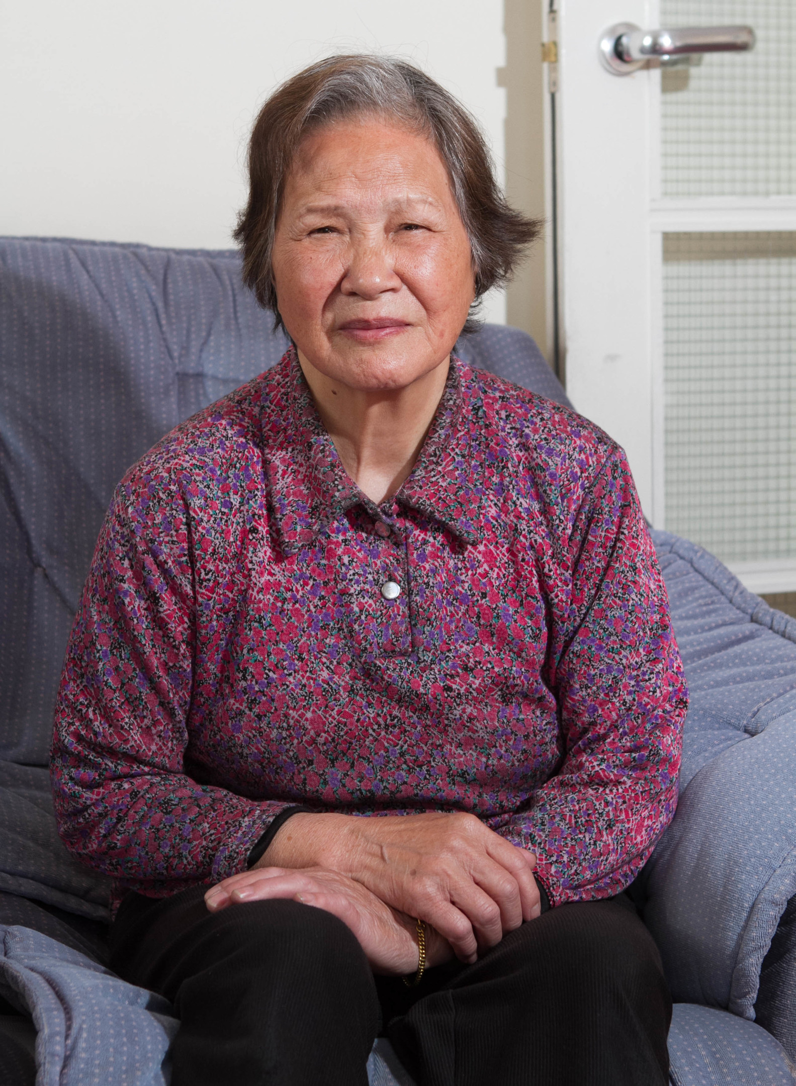 Kam Tai Mo was pictured cleaning her windows on a top floor of flat (Chris Austin/DC Thomson)