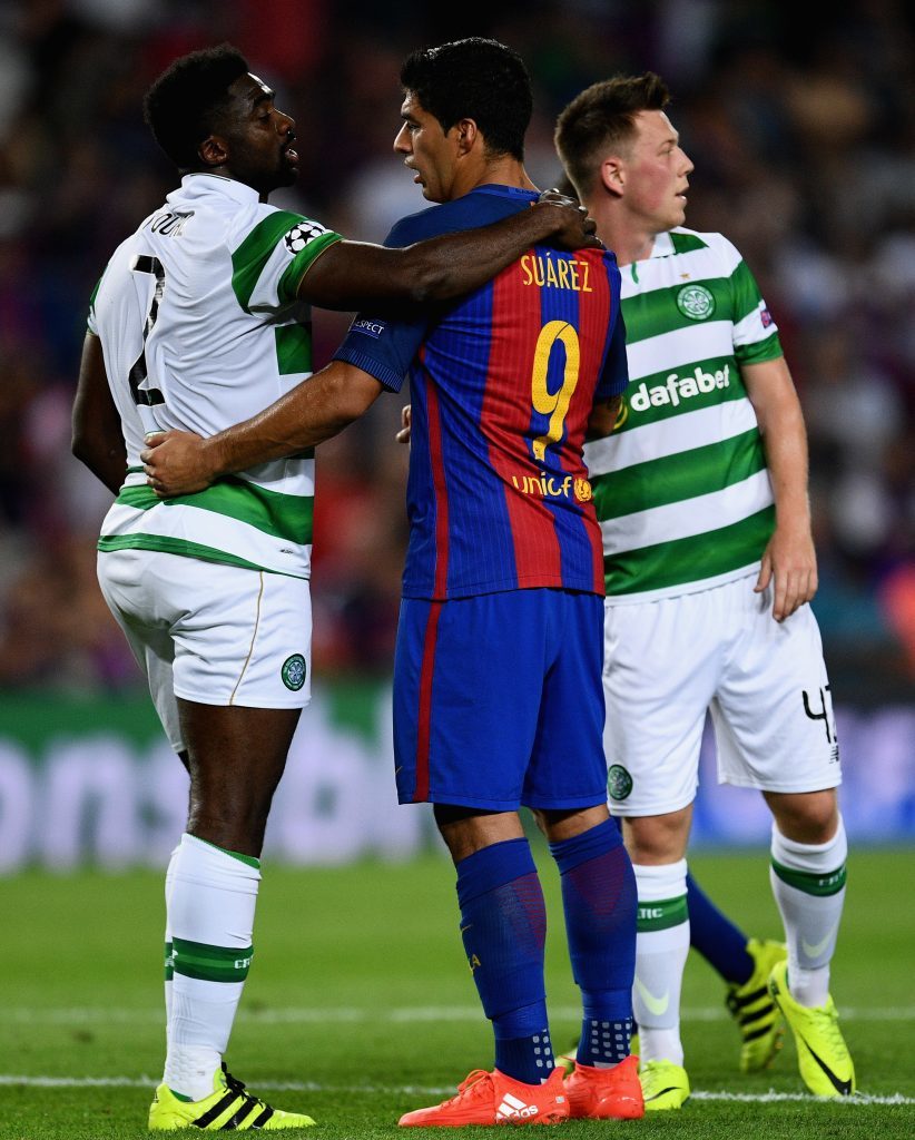 Toure and Luis Suarez embrace after the match (David Ramos/Getty Images)