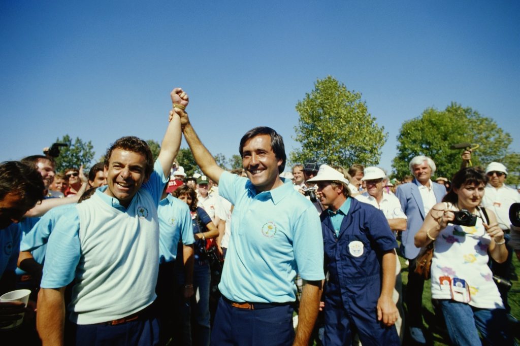 Tony Jacklin (left) and Seve Ballesteros (right) celebrate in 1987. (Simon Bruty/Getty Images)