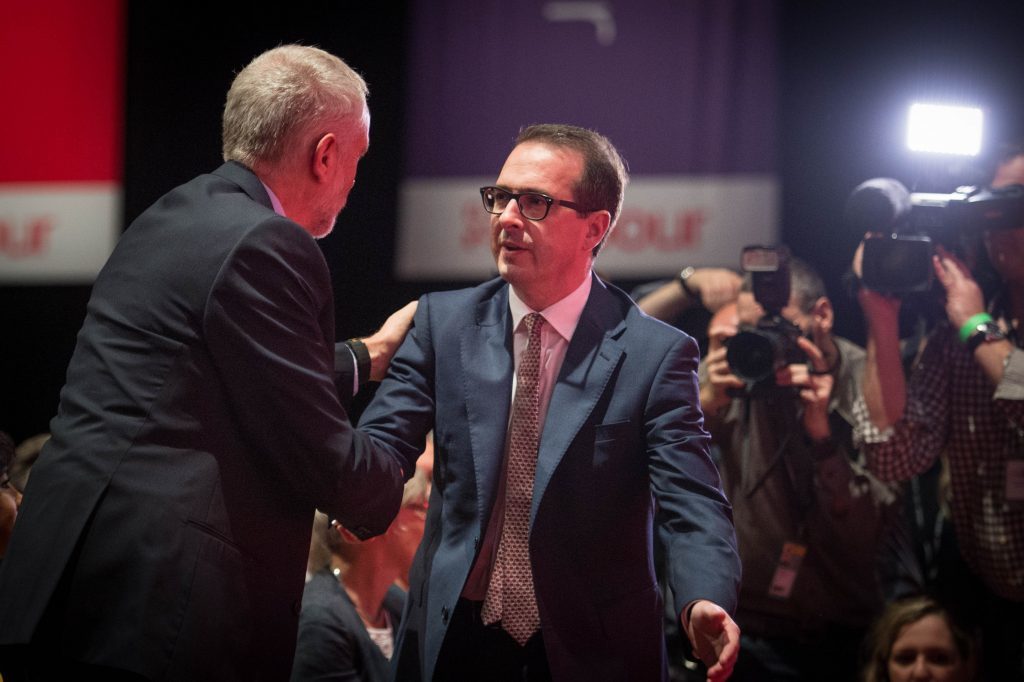 Labour leader Jeremy Corbyn is congratulated by fellow contender Owen Smith (Stefan Rousseau/PA Wire)