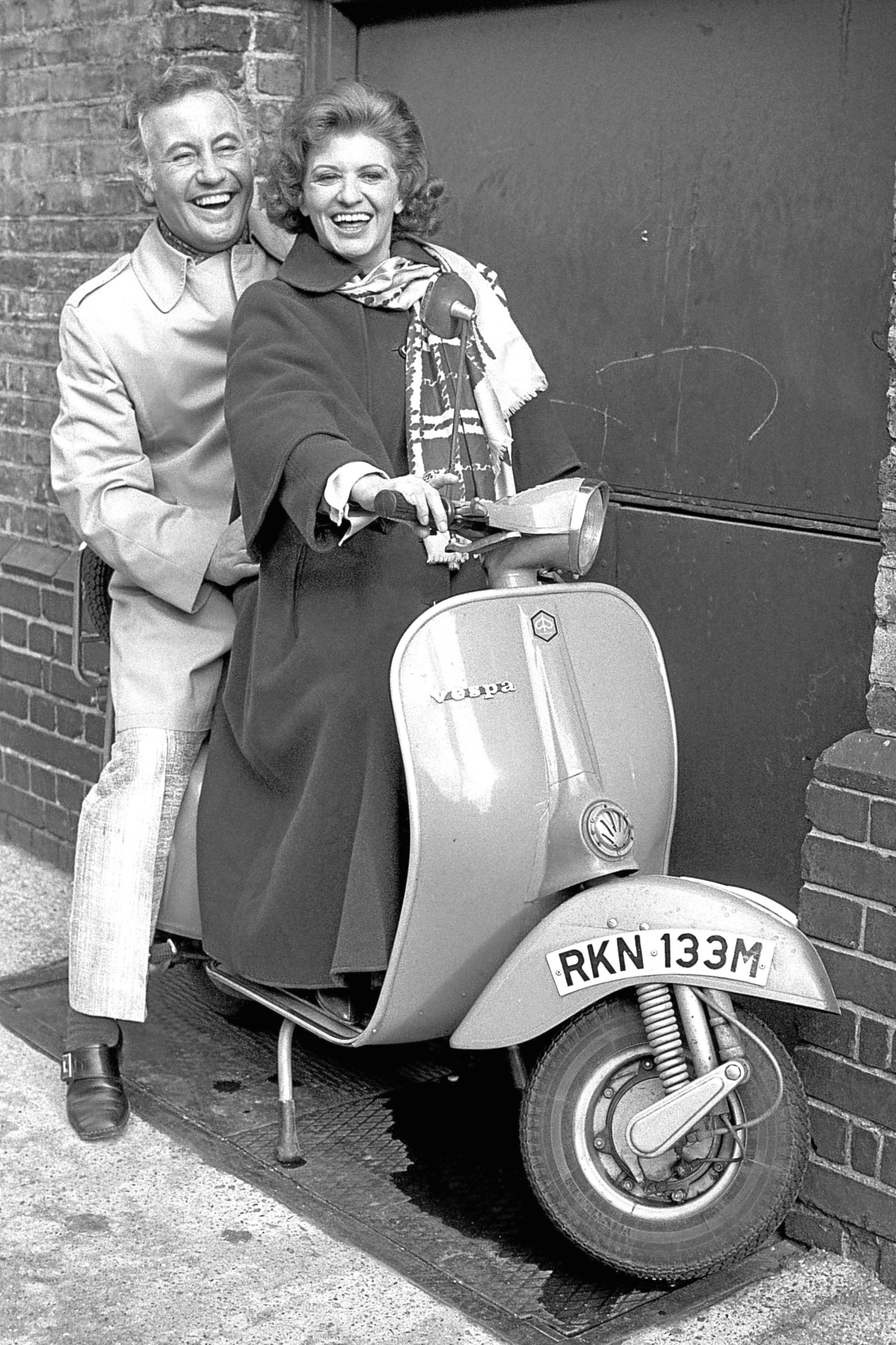 Former player's in Coronation Street Pat Phoenix and Alan Browning astride a motor scooter outside London's Greenwood Theatre 