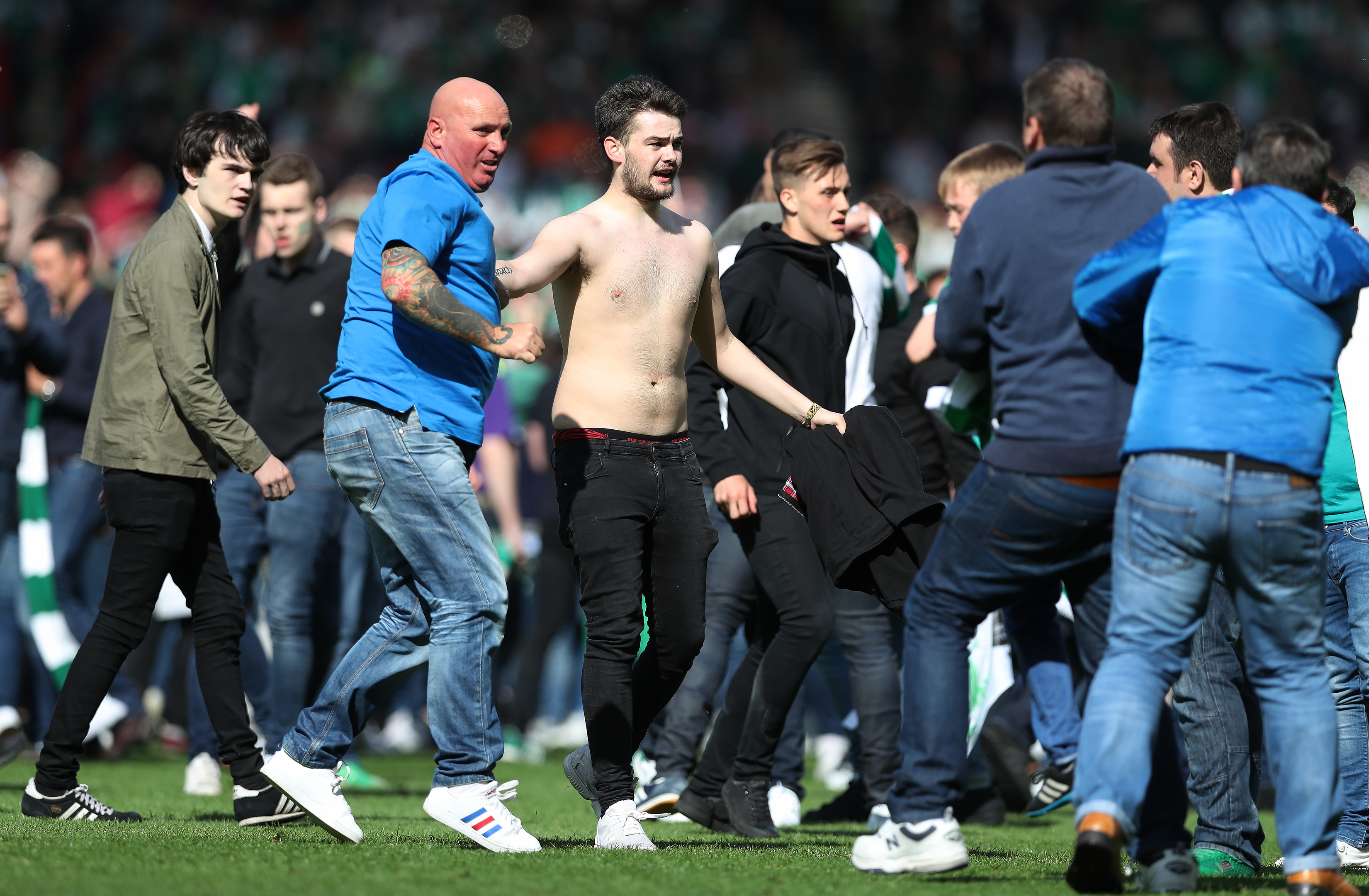 Rangers and Hibs fans confront each other during the Scottish Cup Final between Rangers and Hibernian at Hampden Park in May (Photo by Ian MacNicol/Getty)