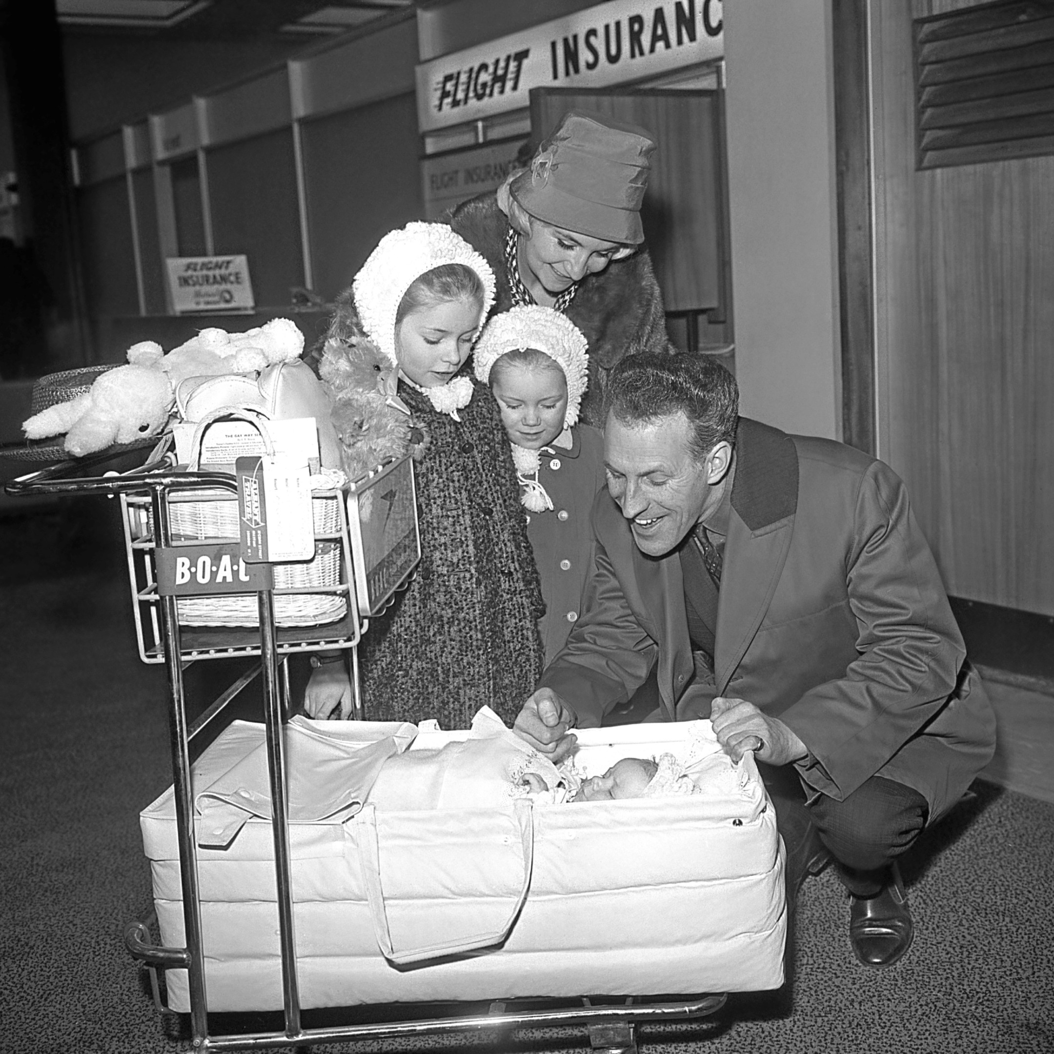 Bruce Forsyth wife his wife Penny and children Debbie, 7, Julie, 4, and 3-month-old Laura. They were leaving for a month's holiday in Barbados.