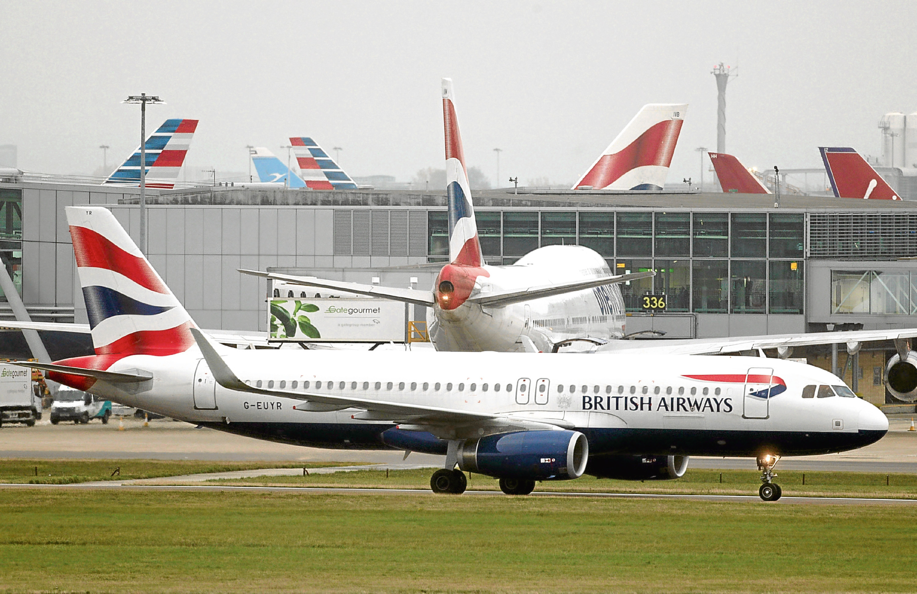 British Airways planes on the runway at Heathrow Airport (Yui Mok/PA)