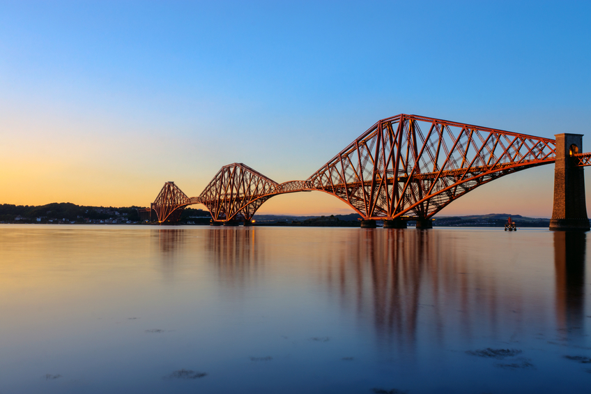 The Forth Rail Bridge in Scotland at sunset