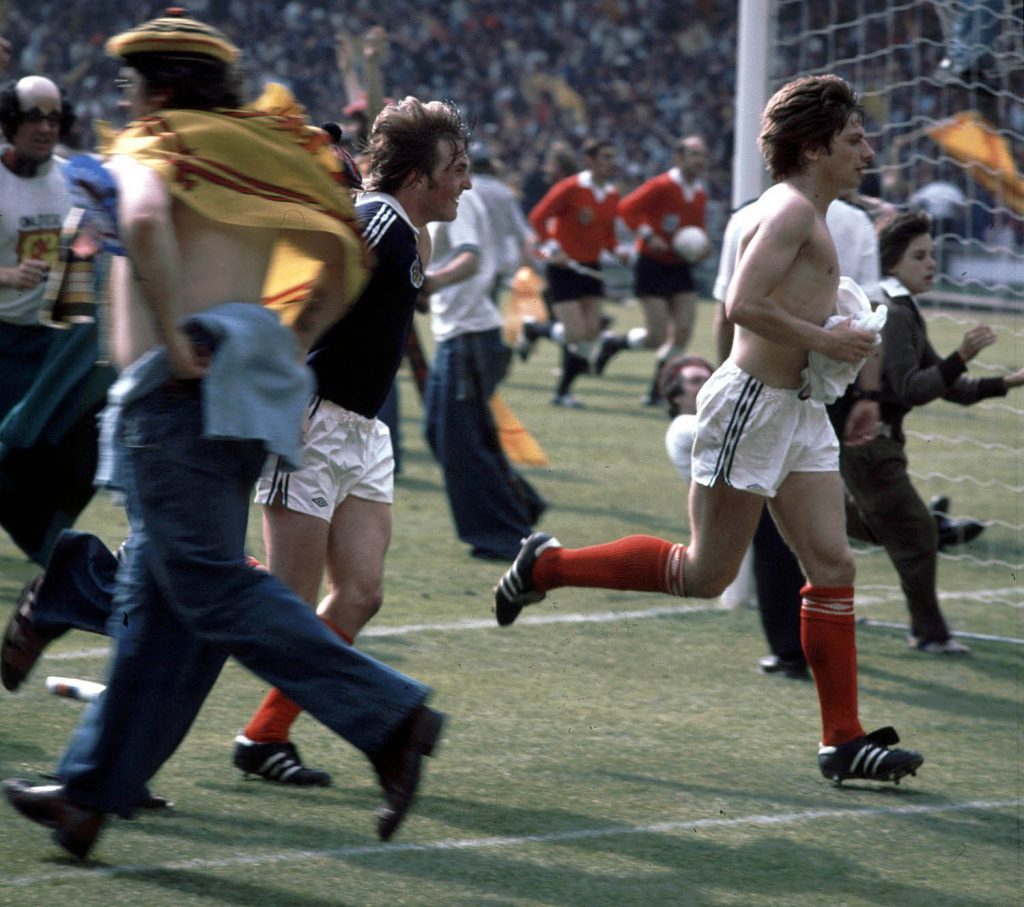 Kenny Dalglish (left) and Willie Donnachie go wild along with the Tartan Army after Scotland beat England at Wembley (SNS Group)