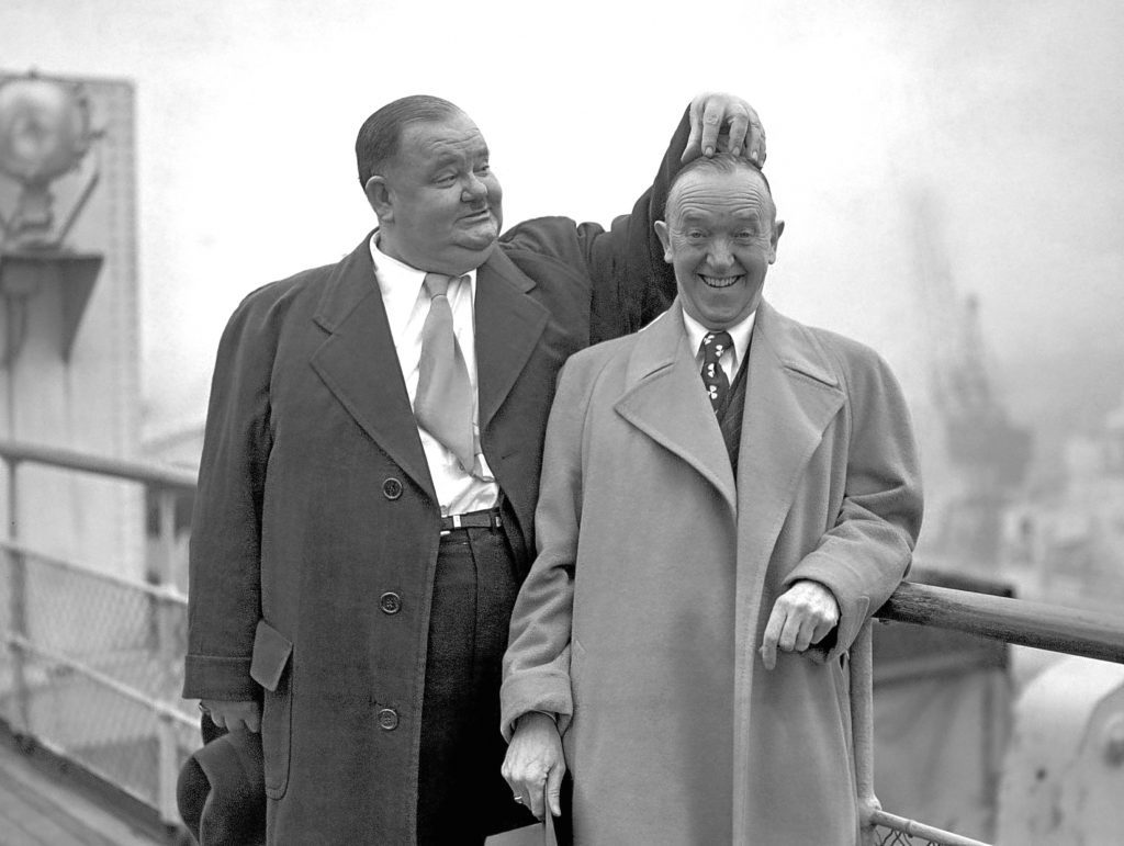 Oliver Hardy scratches the head of Stan Laurel, 1932 (PA Wire)