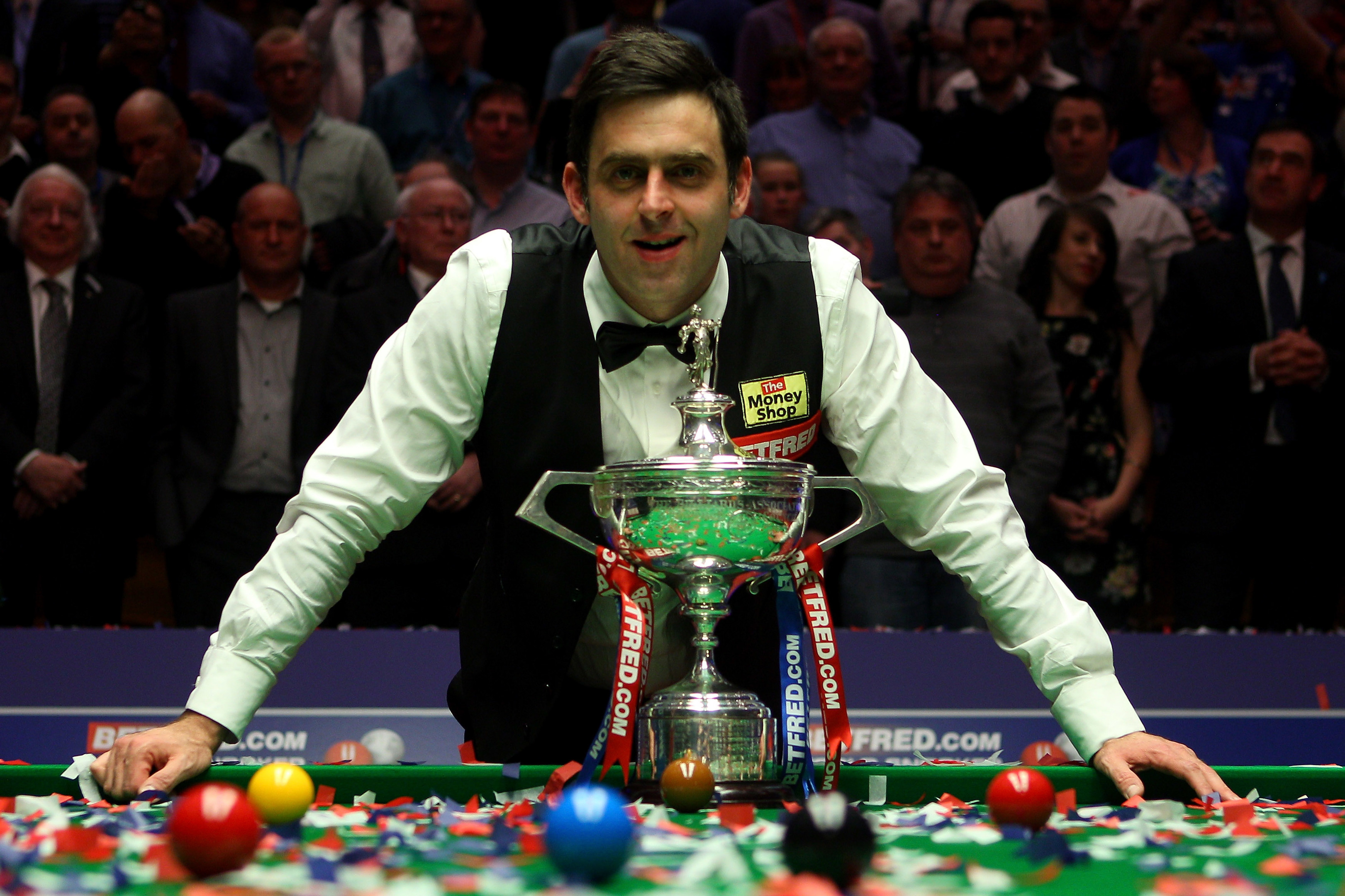 Ronnie O'Sullivan of England poses with the trophy after beating Allister Carter of England in the final of the Betfred.com World Snooker Championship, 2012 (Photo by Warren Little/Getty Images)