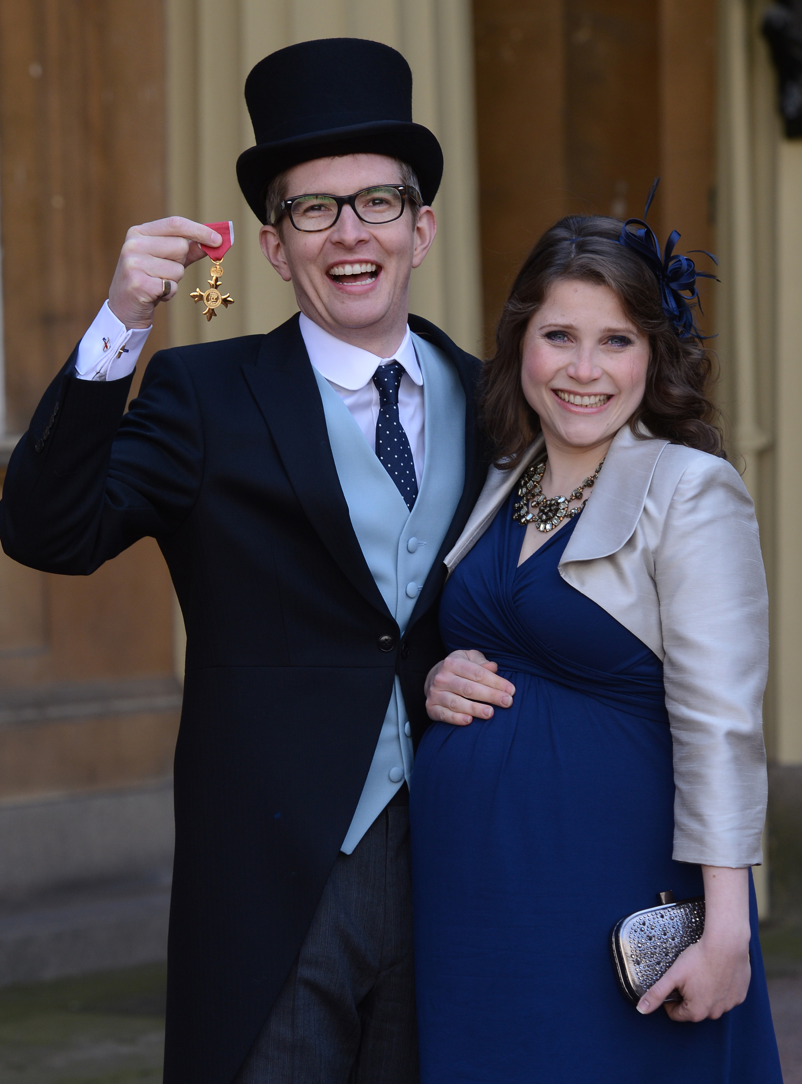 Choirmaster Gareth Malone and his wife Rebecca at Buckingham Palace where he received an OBE (Photo by Stefan Rousseau - WPA Pool /Getty Images)