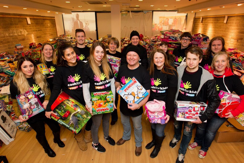 Ian Robertson (centre) with volunteers who are sorting through the toys (Andrew Cawley / DC Thomson)