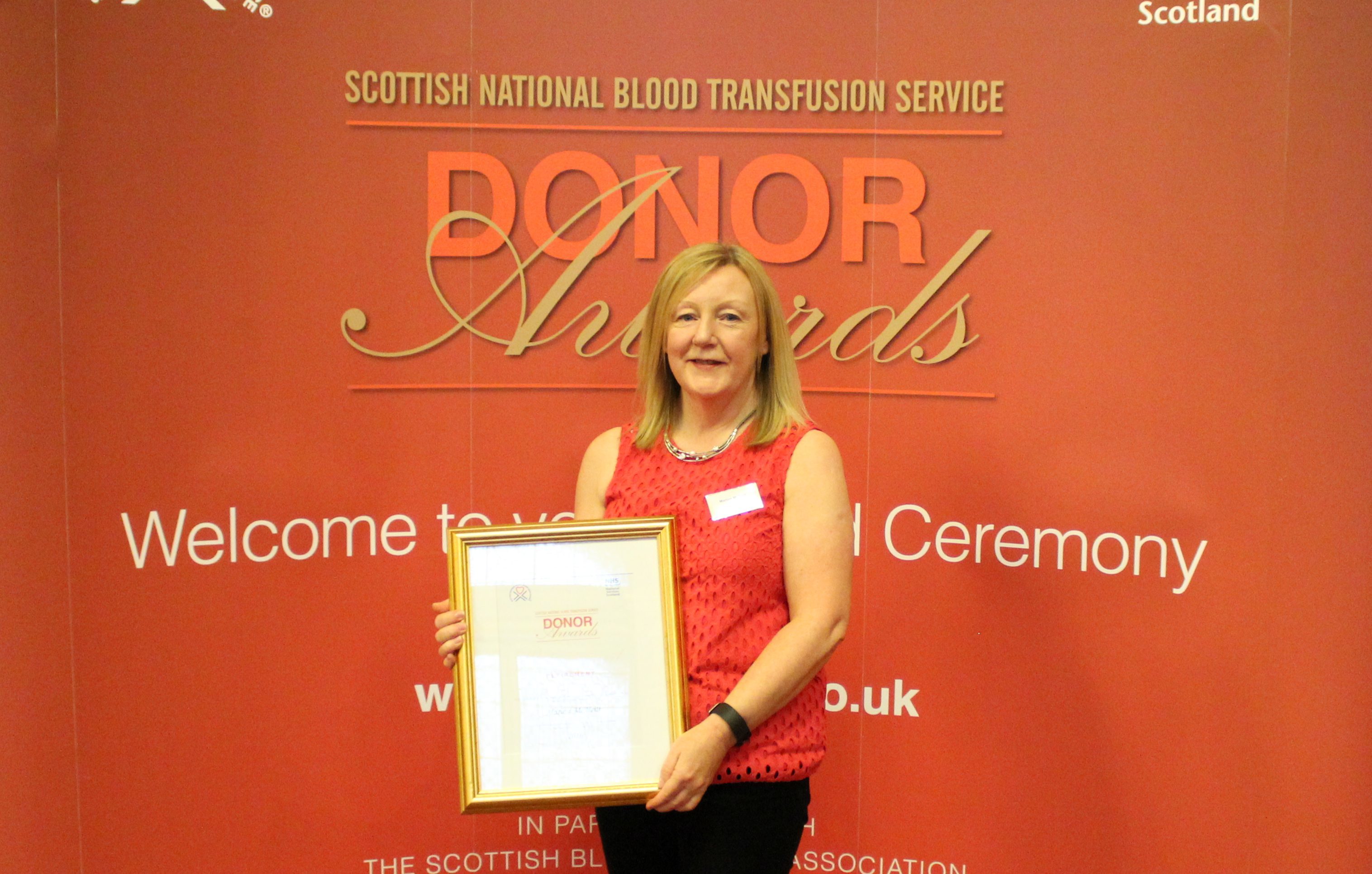 Marion was awarded with her certificate in Glasgow after giving 100 pints of blood