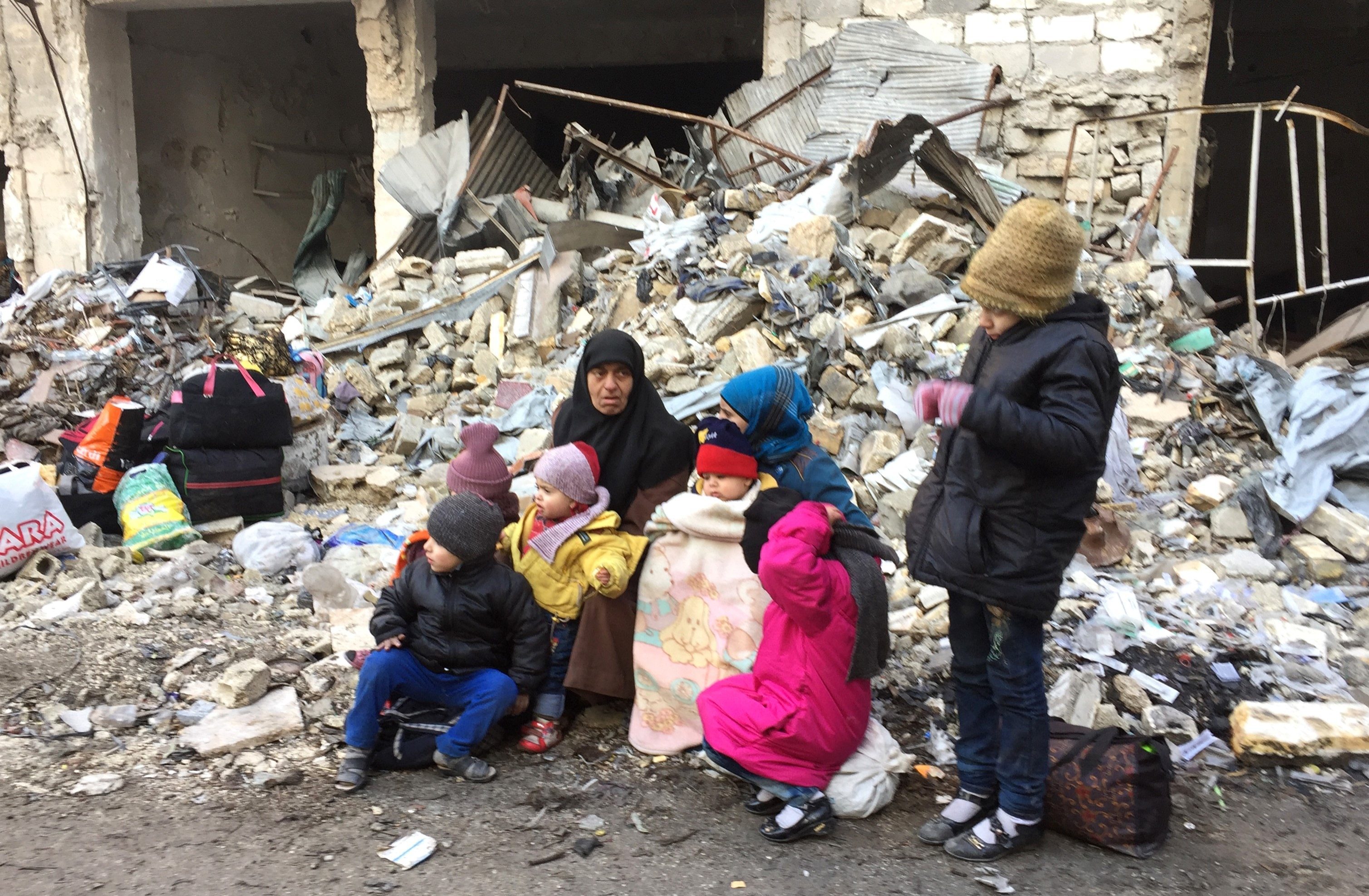 Civilians wait to be evacuated from Aleppo (Mamun Ebu Omer/Anadolu Agency/Getty Images)
