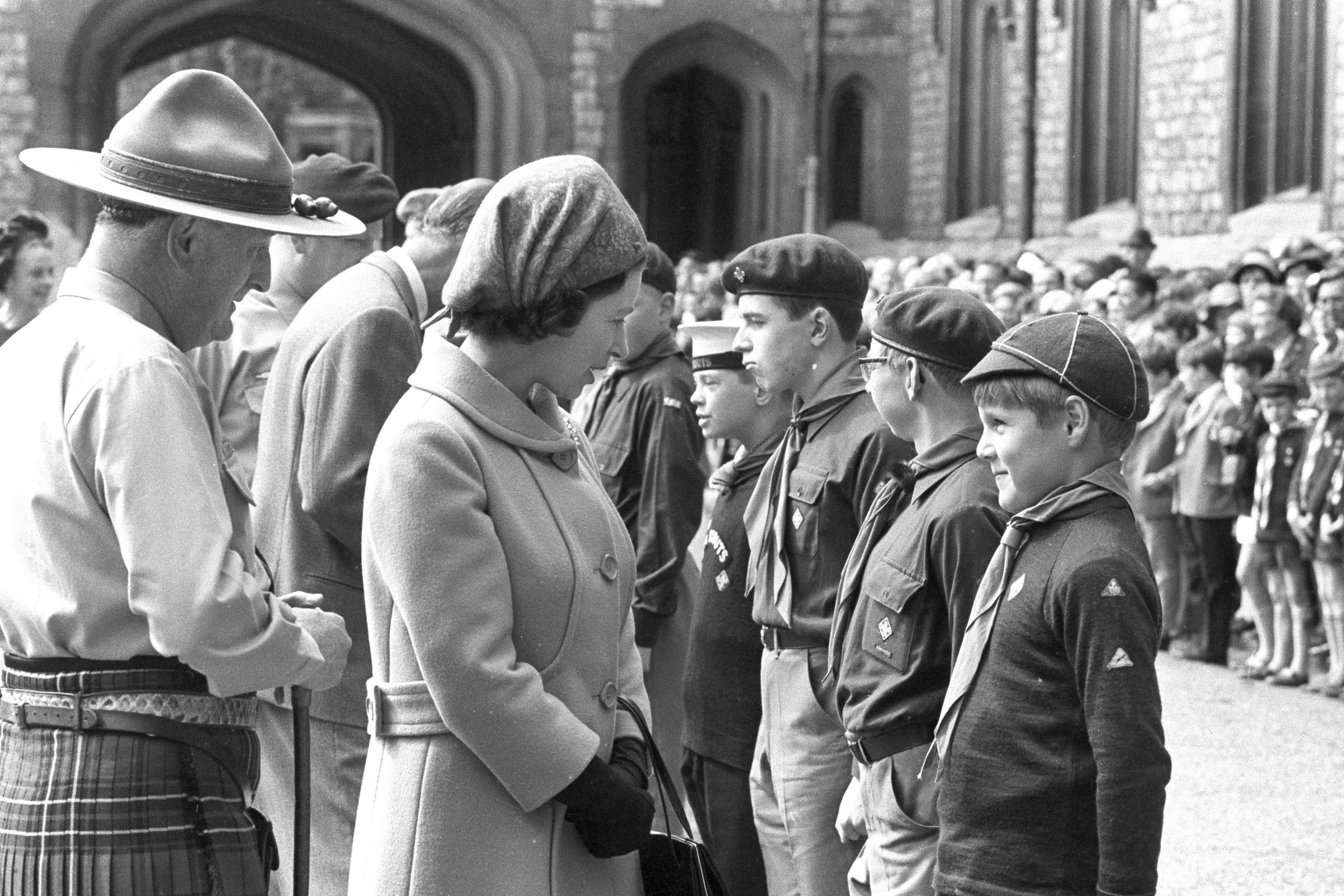 Queen Elizabeth II talking to Cub Scout Paul Hewitt in 1969 (PA/PA Wire)