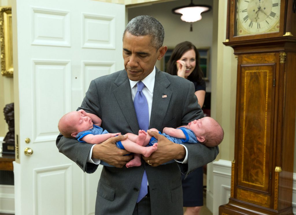 June 17, 2015 “The President carries the twin boys of Katie Beirne Fallon, Director of Legislative Affairs, into the Oval Office just a few months after they were born.” (Official White House Photo by Pete Souza)
