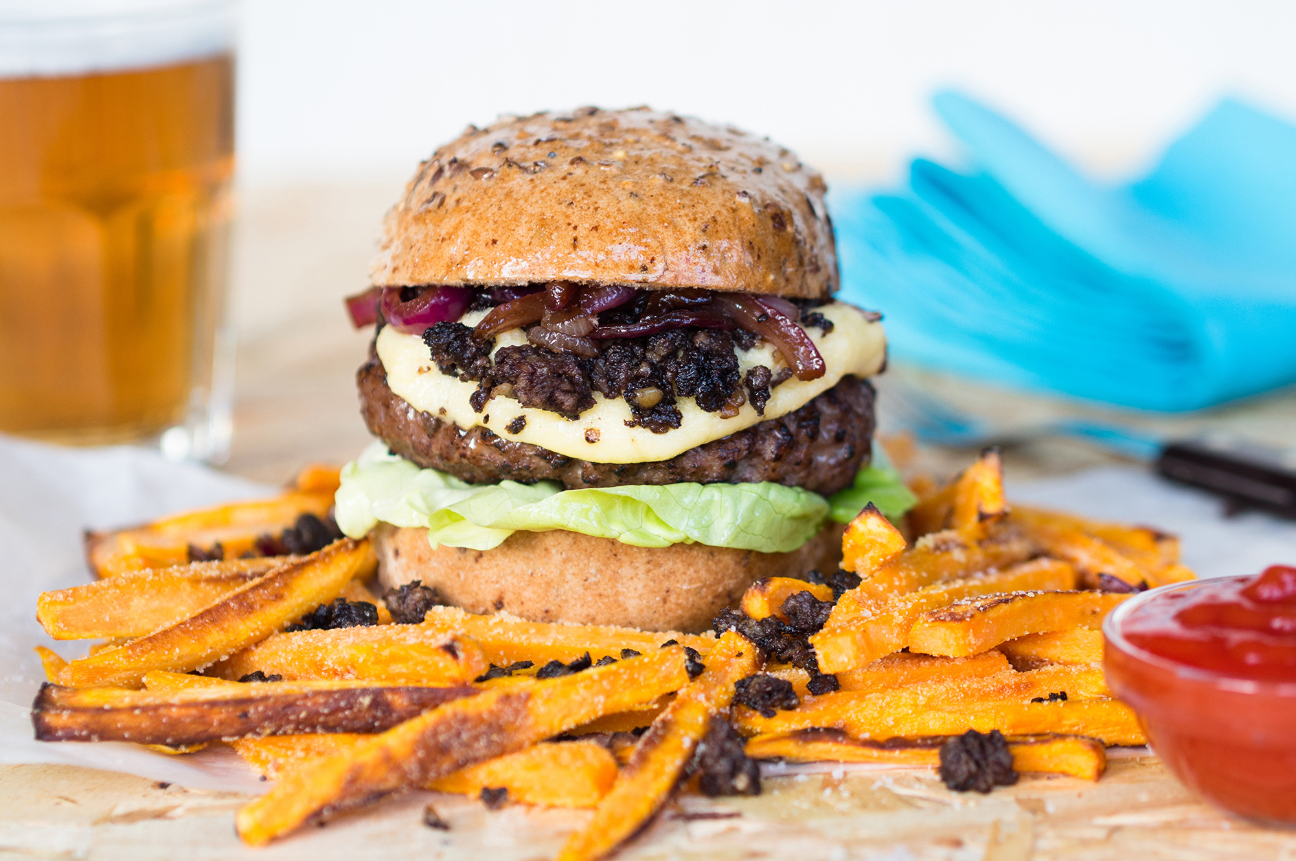 A Genius Gluten Free steak and haggis burger with red onion relish