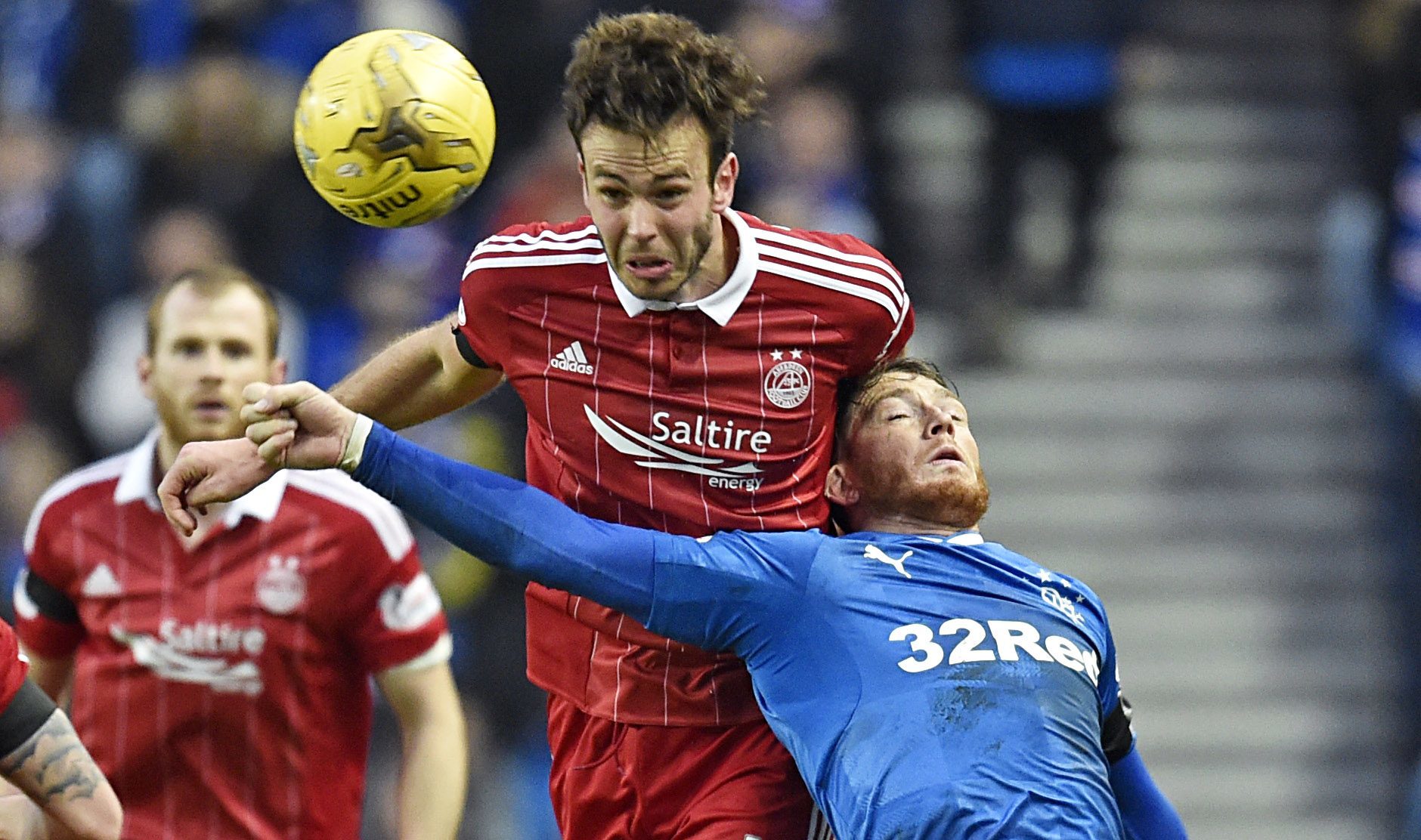 Andrew Considine battles for the ball with Rangers striker Joe Garner (SNS Group)