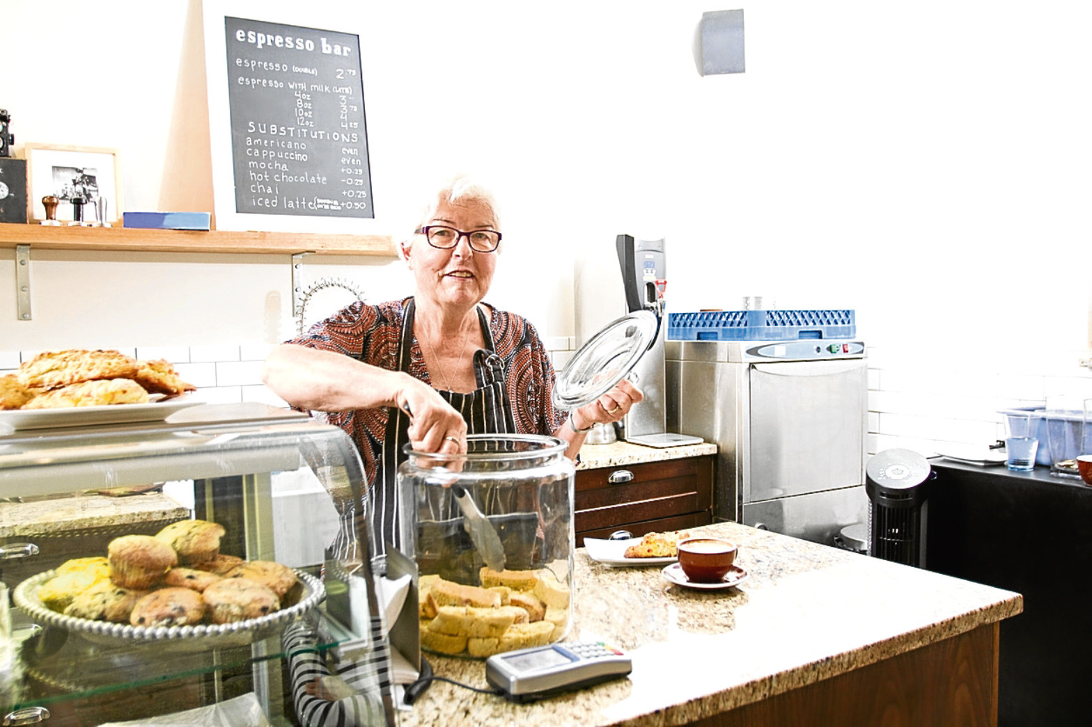 Senior lady working in coffee shop (Getty Images)