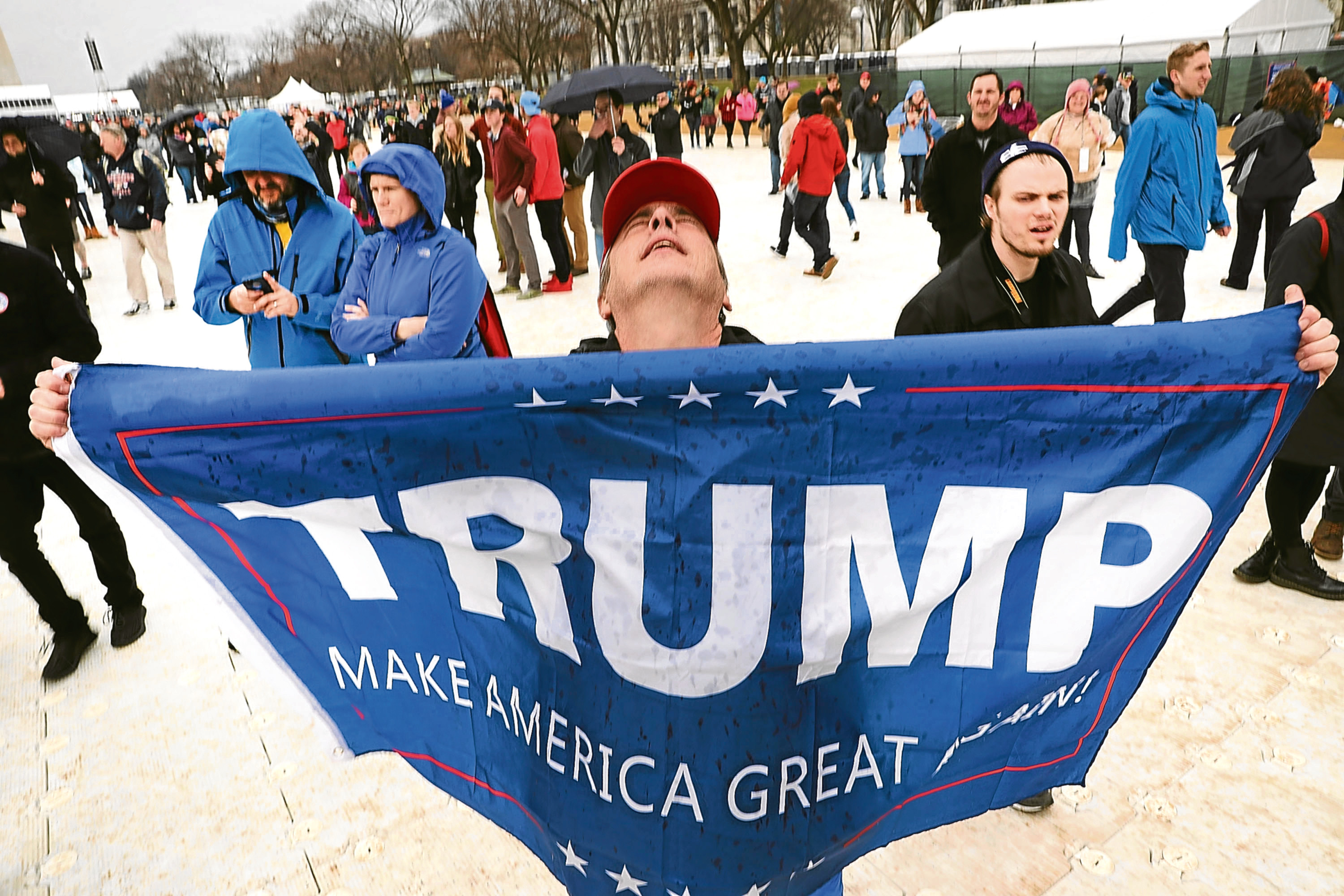 President Donald Trump supporters react on the National Mall to the inauguration of US President Donald Trump    (Photo by Spencer Platt/Getty Images)